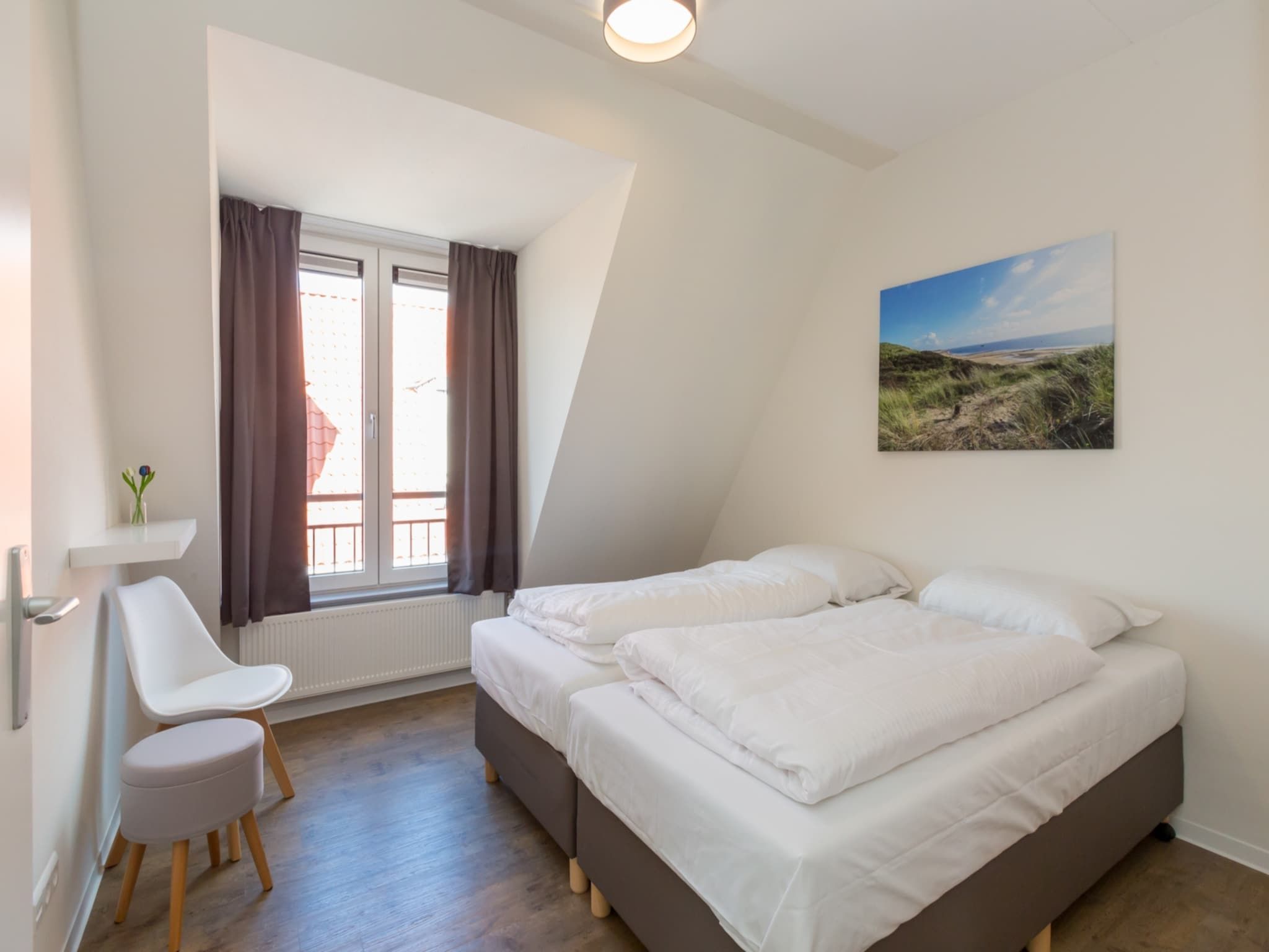 Een slaapkamer van Aparthotel Zoutelande - 5 pers luxe appartement in Zoutelande