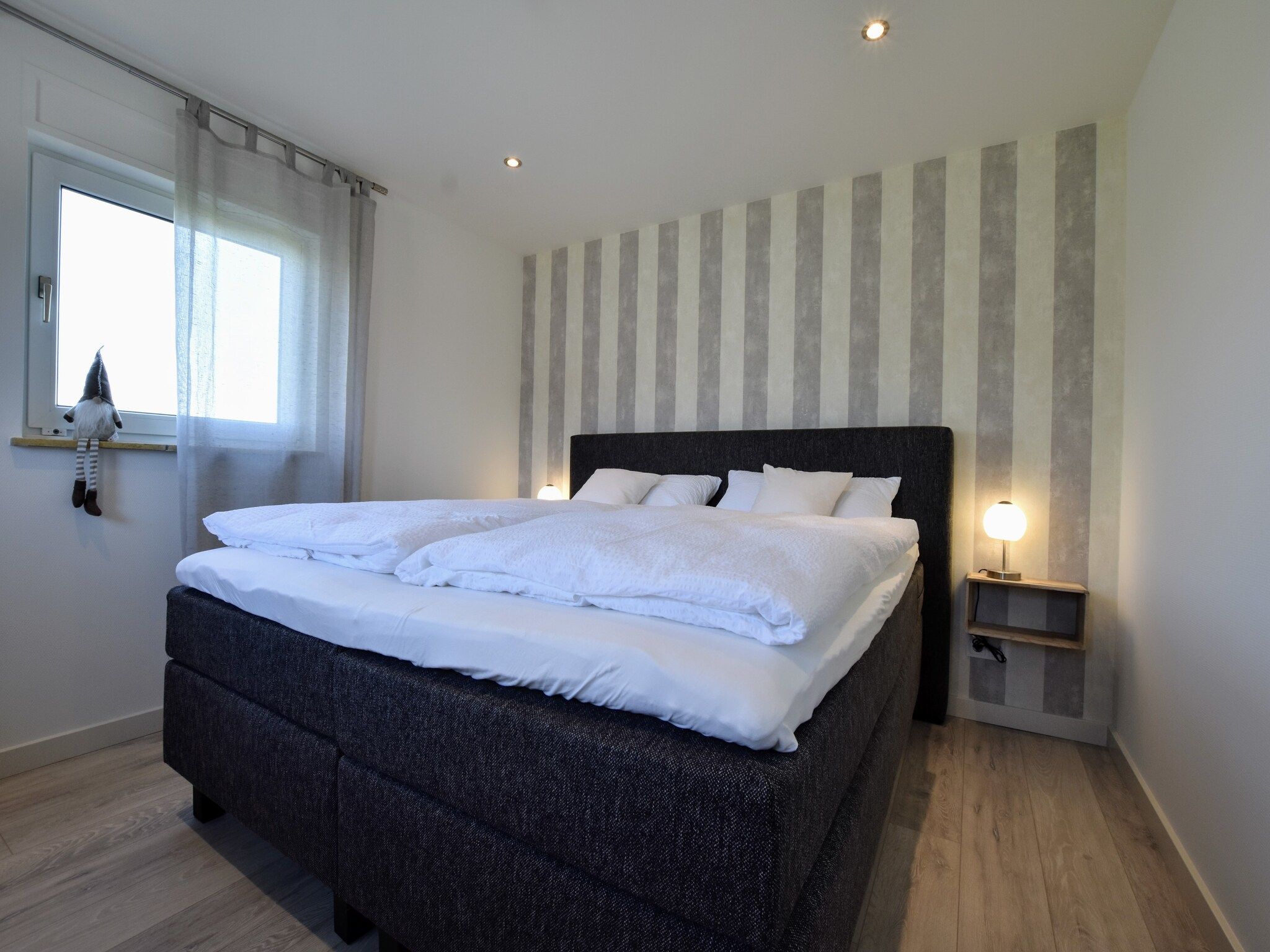 Een slaapkamer van Villa Grenszicht in Megchelen