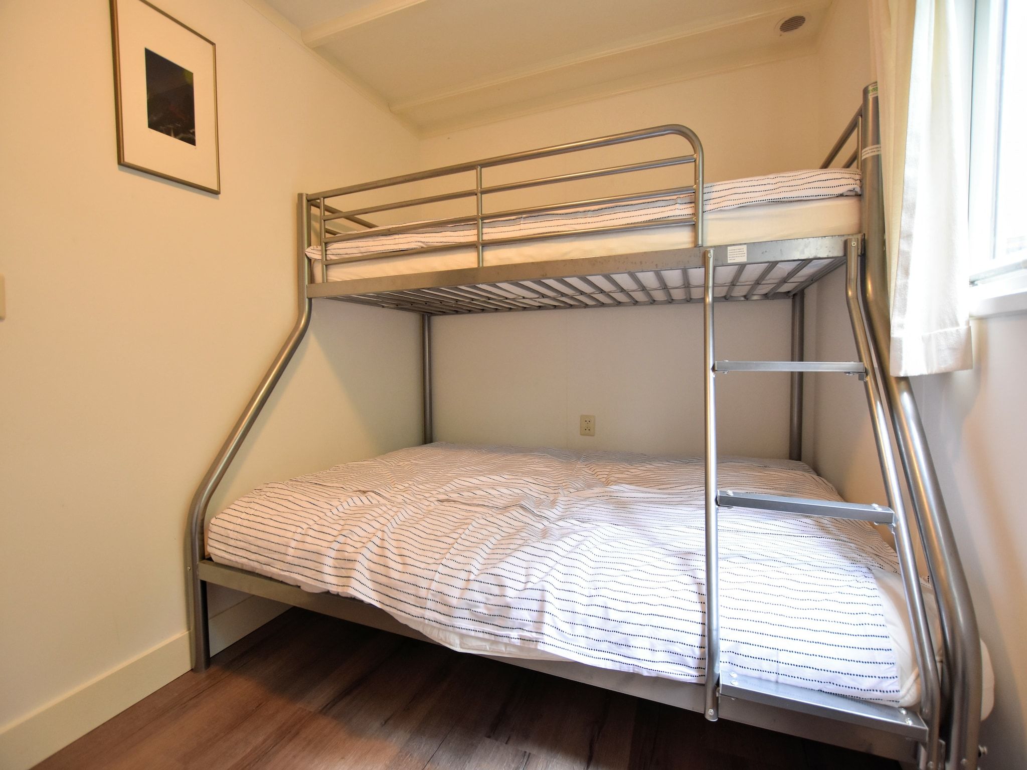Een slaapkamer van Reewold in Putten