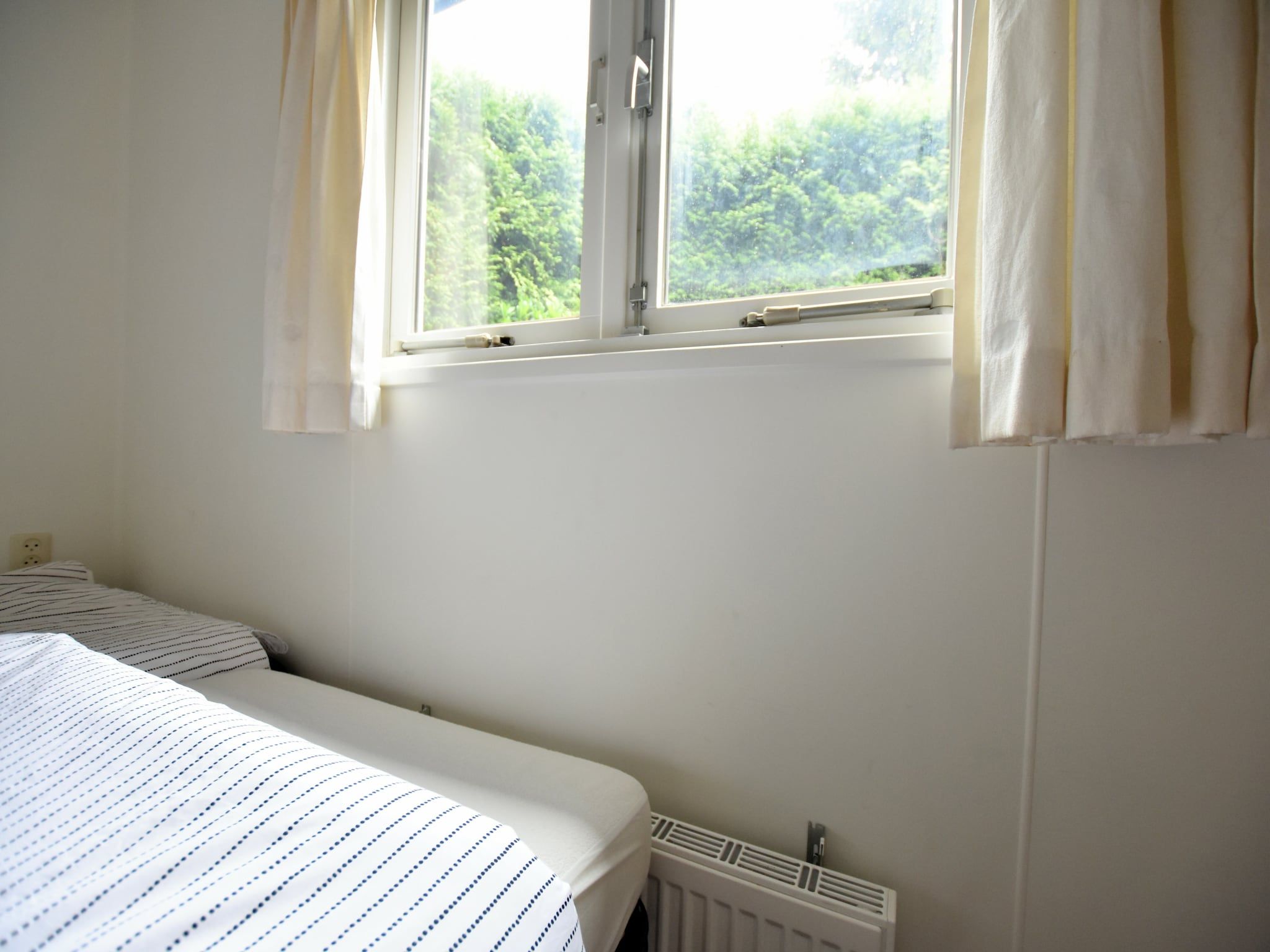 Een slaapkamer van Reewold in Putten