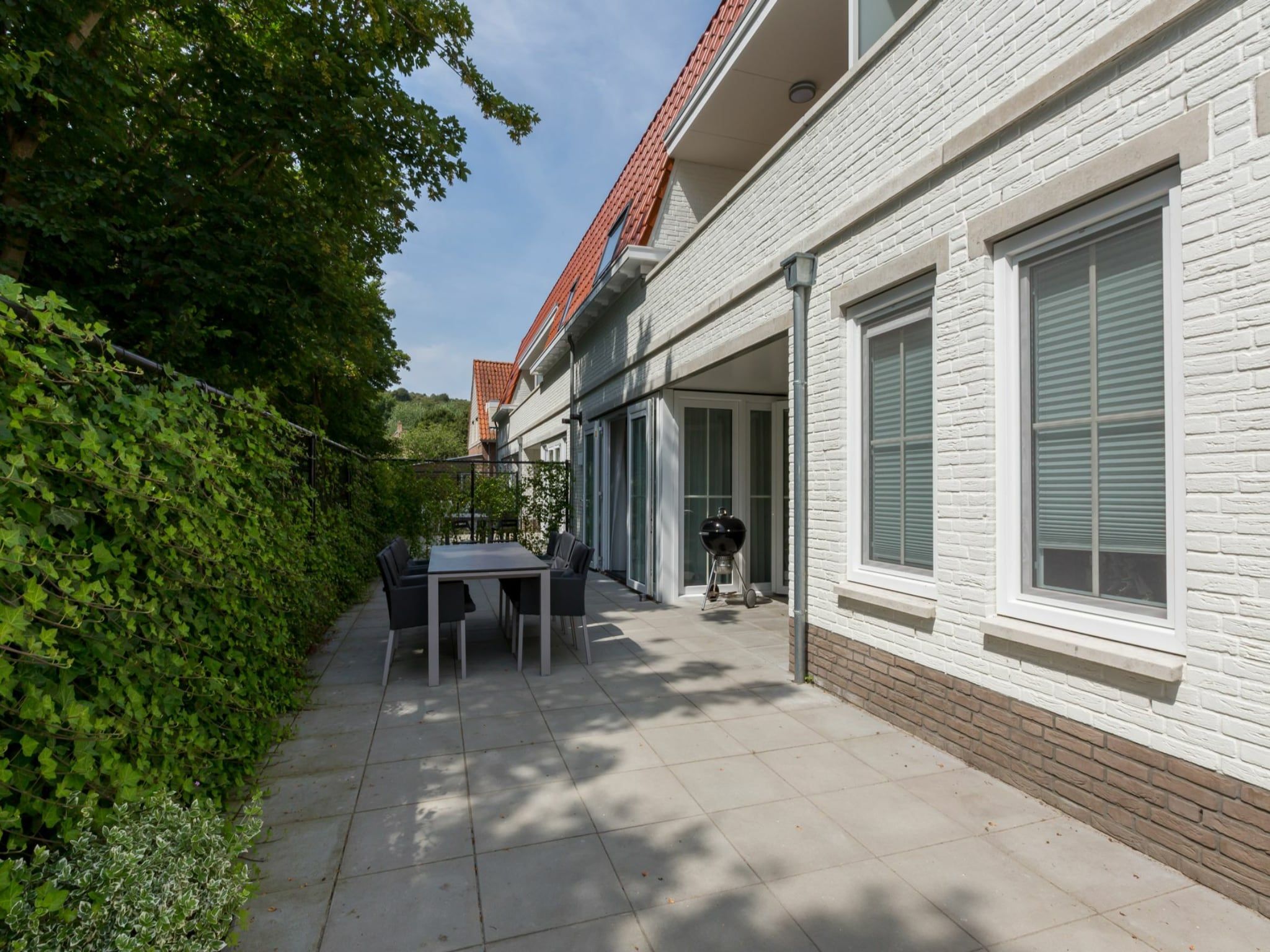 De tuin van Appartement Duinhof Dishoek 13H - 6 pers de luxe in Koudekerke