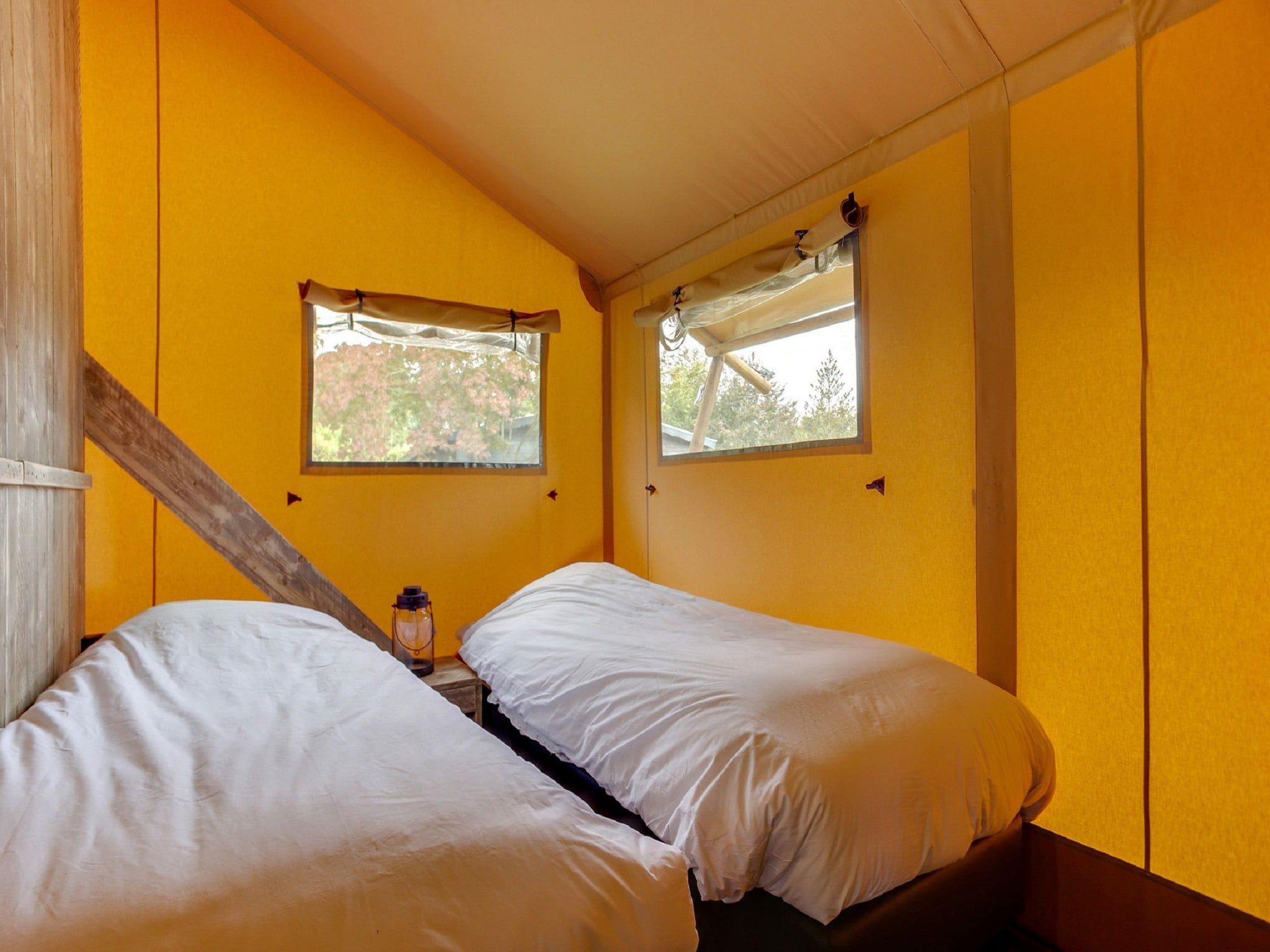 Een slaapkamer van Vakantiepark Sandberghe 10 in Uden