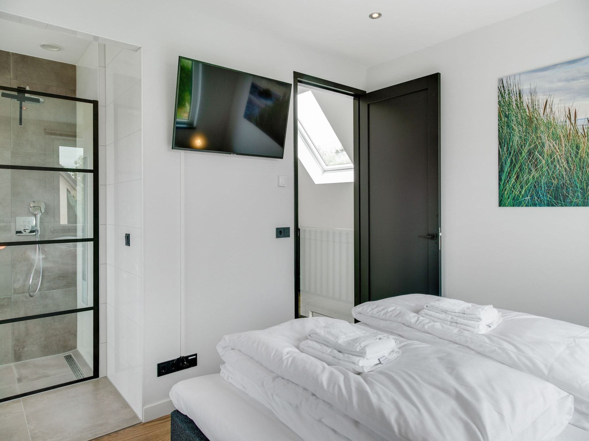 Een slaapkamer van De Koog  nr 4 - 6 pers woning de luxe in De Koog Texel