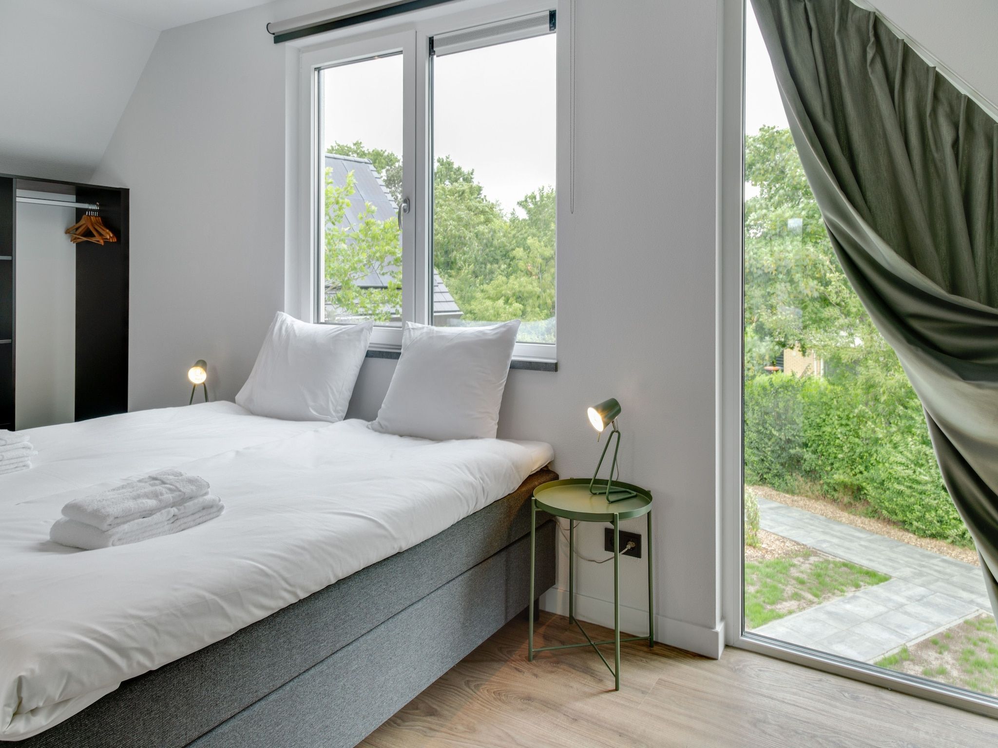 Een slaapkamer van De Koog  nr 4 - 6 pers woning de luxe in De Koog Texel