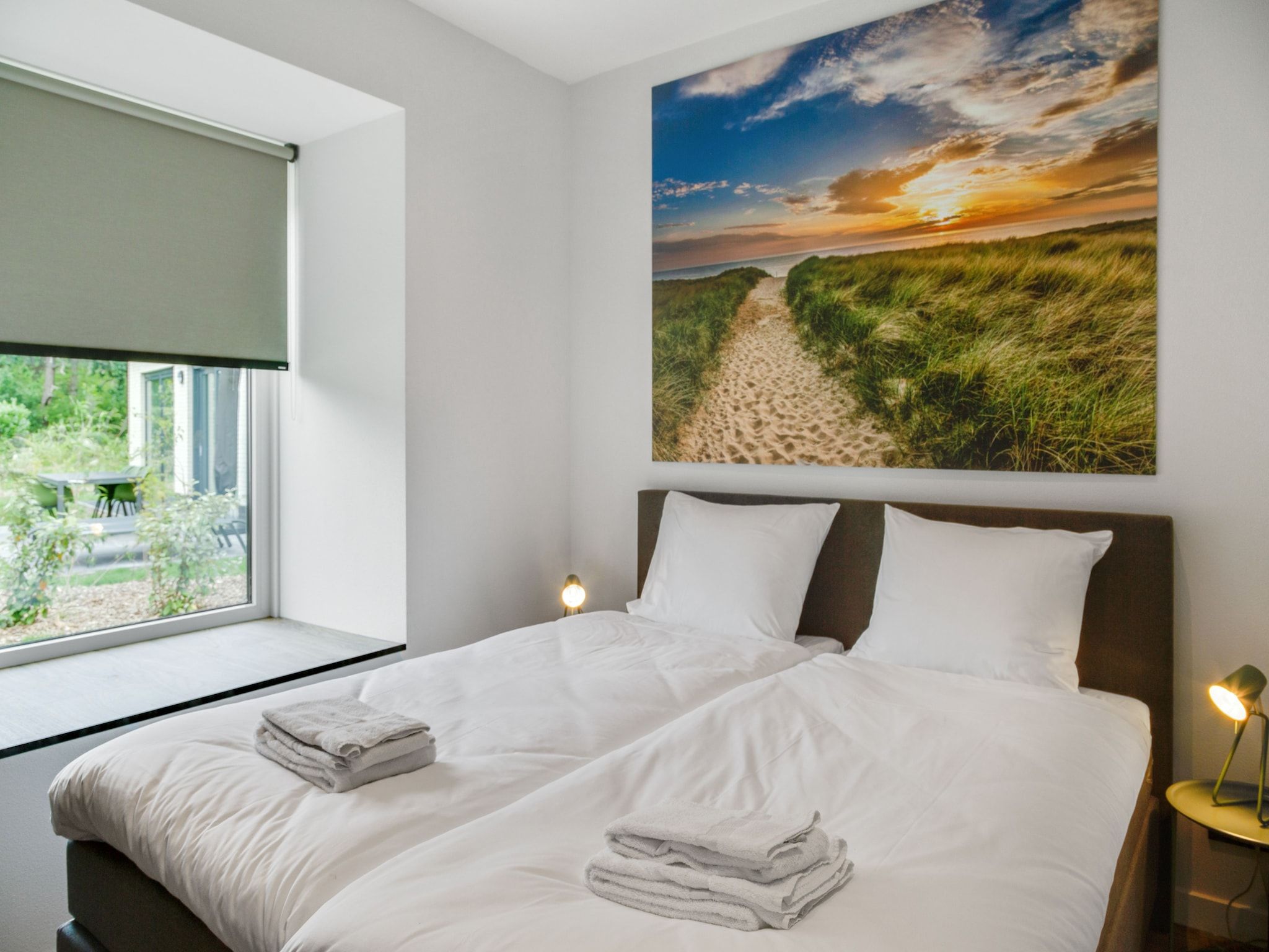 Een slaapkamer van De Koog  nr 5 - 6 pers woning de luxe in De Koog Texel