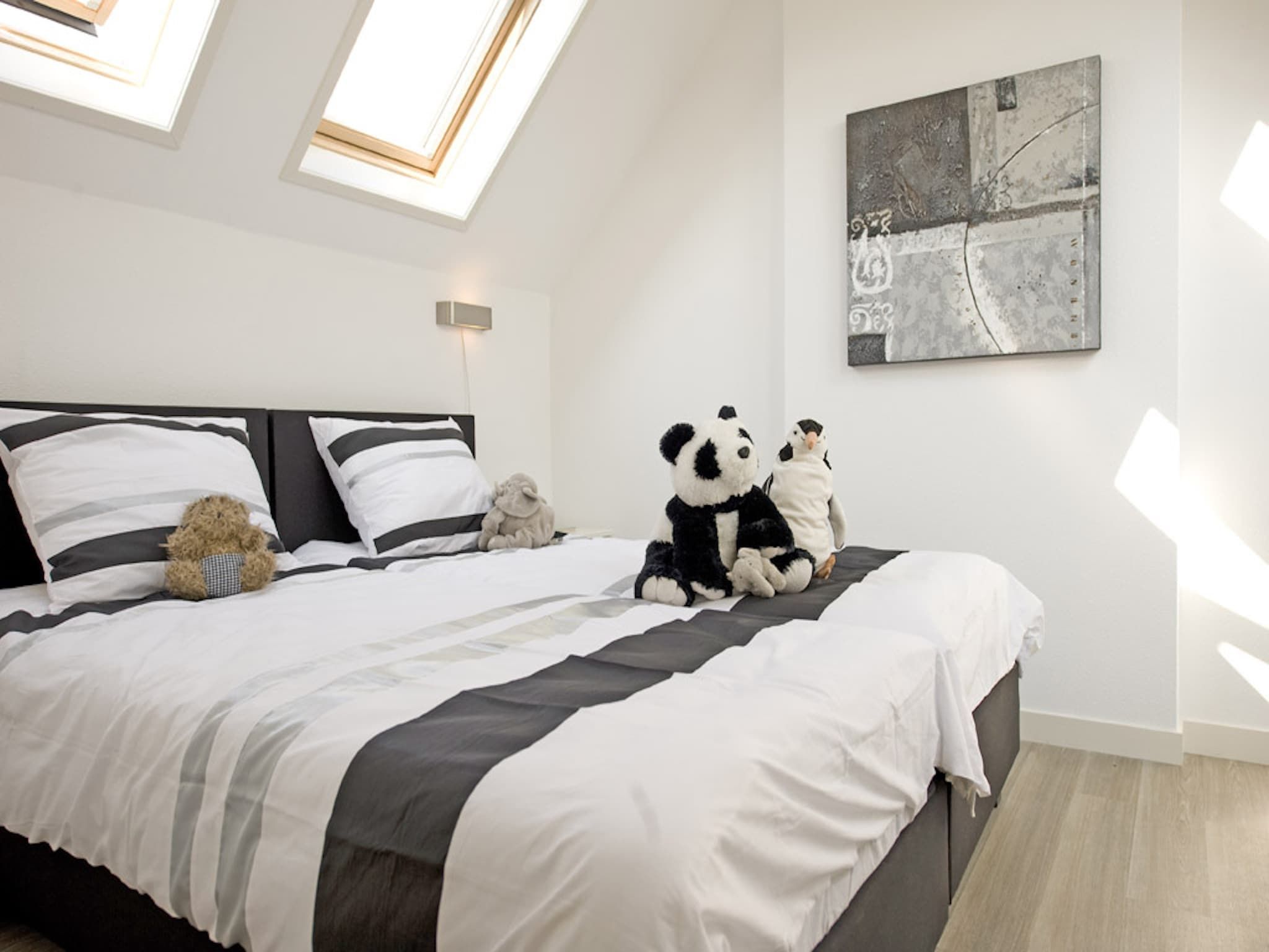 Een slaapkamer van Resort Waterrijk Oesterdam 3 in Tholen
