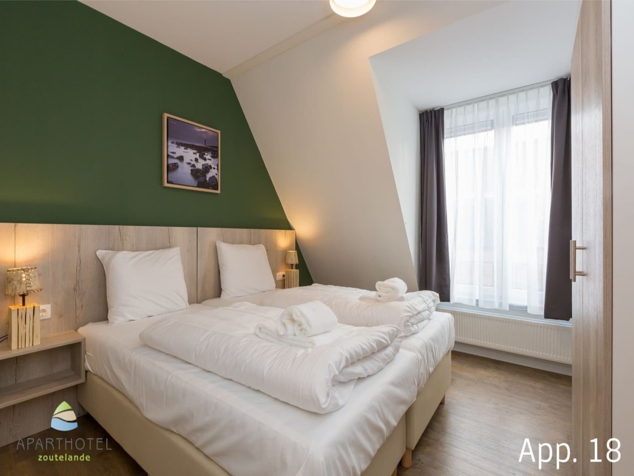 Een slaapkamer van Aparthotel Zoutelande - 6 pers luxe appartement huisdier in Zoutelande