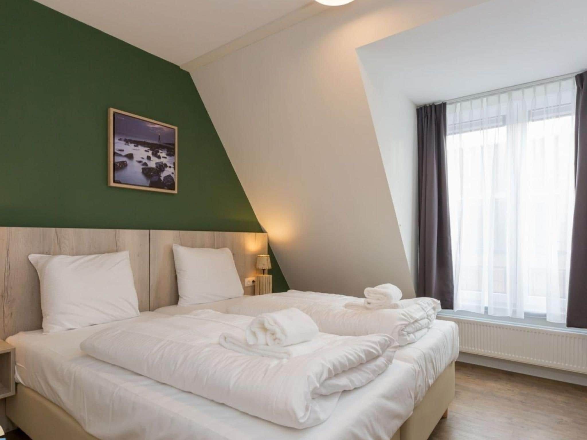 Een slaapkamer van Aparthotel Zoutelande - 6 pers luxe appartement huisdier in Zoutelande