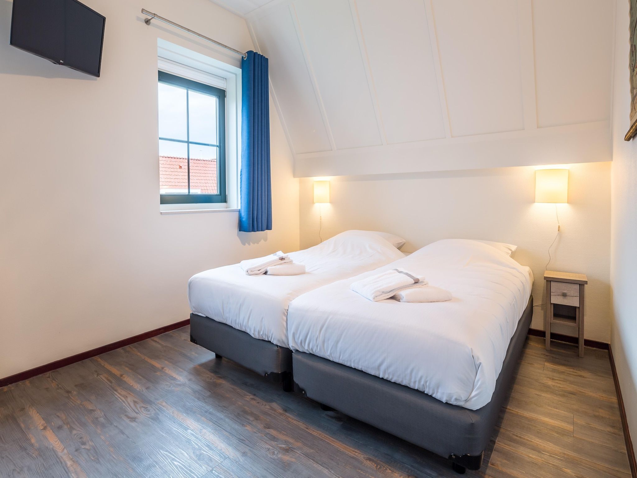 Een slaapkamer van Marinapark Volendam 14 in Volendam