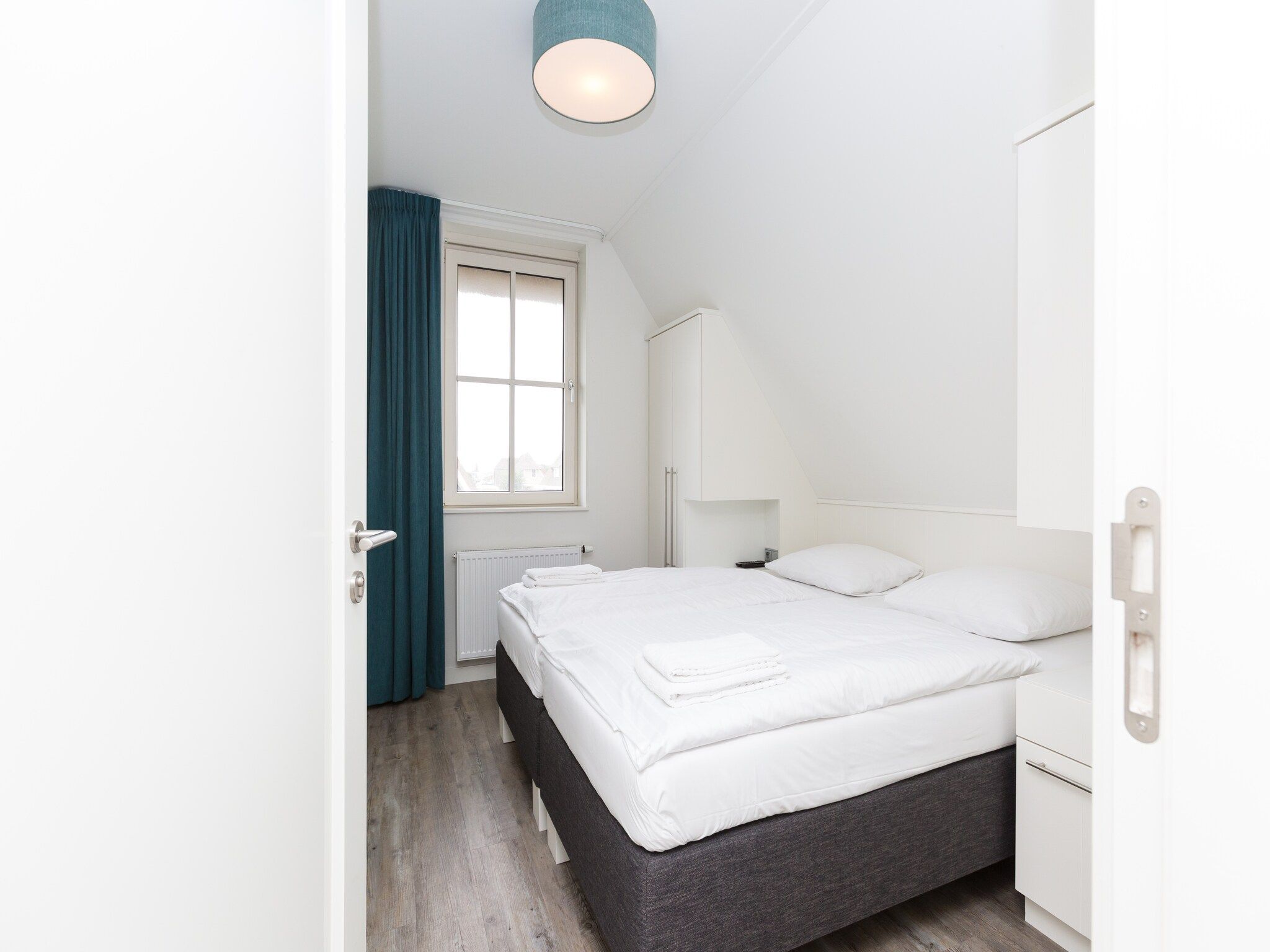 Een slaapkamer van Friese Meren Villa's 10 in Delfstrahuizen