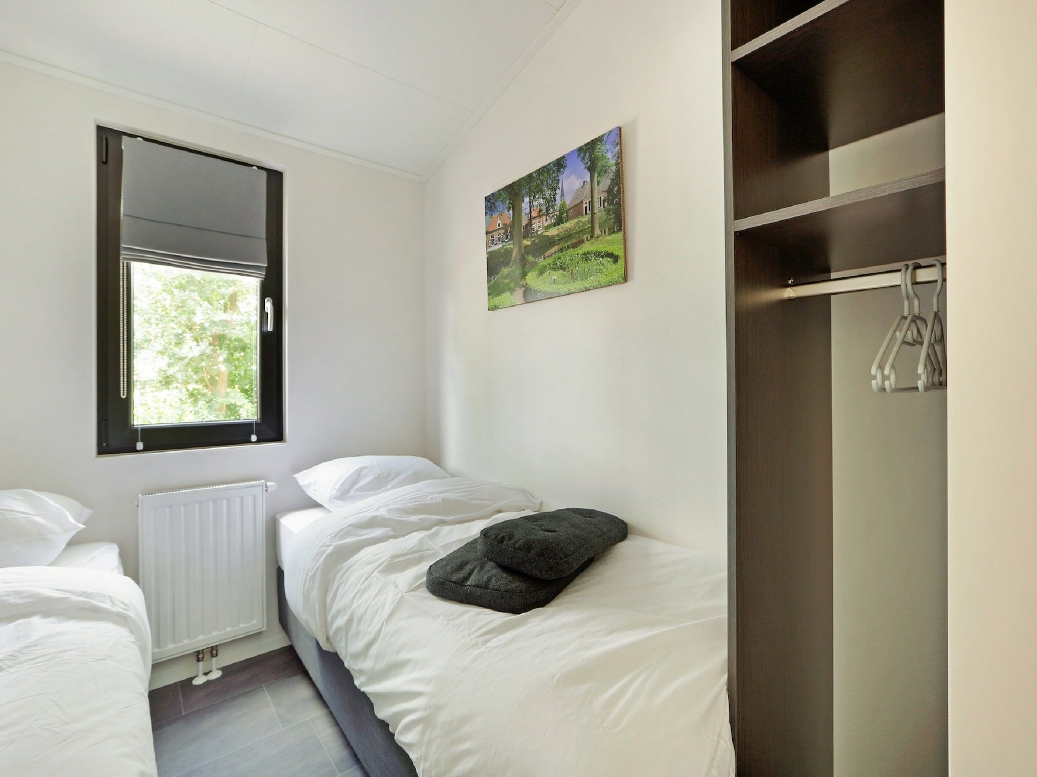 Een slaapkamer van Vakantiepark De Lochemse Berg 1 in Lochem