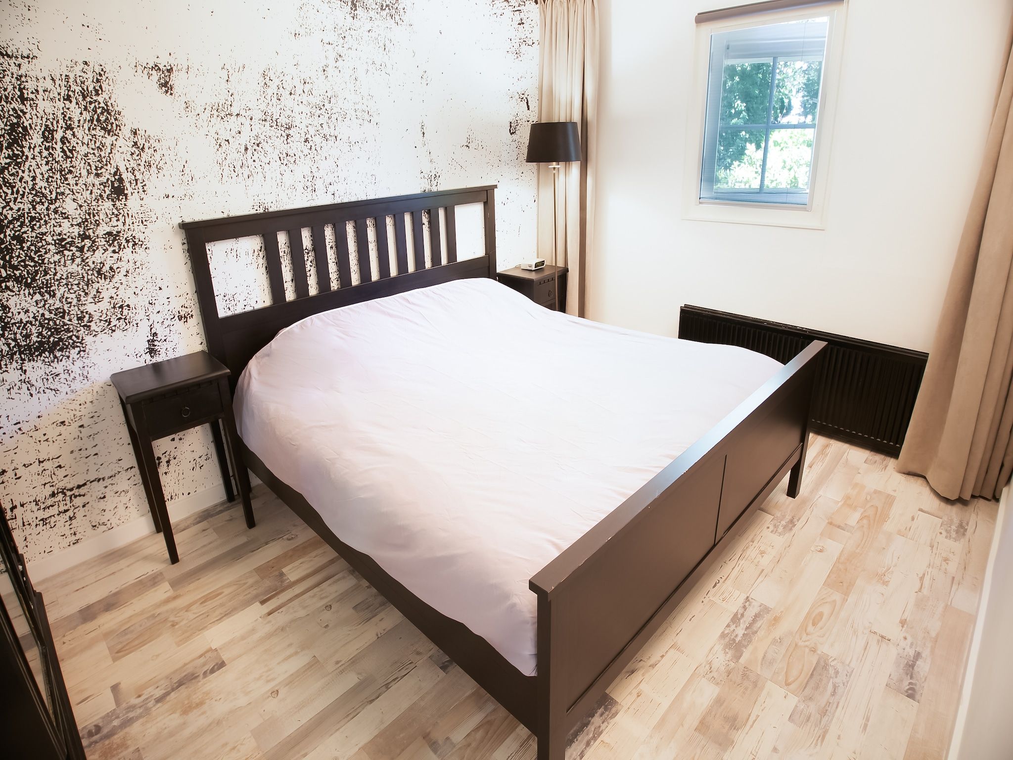 Een slaapkamer van Botterlodge in Wateren
