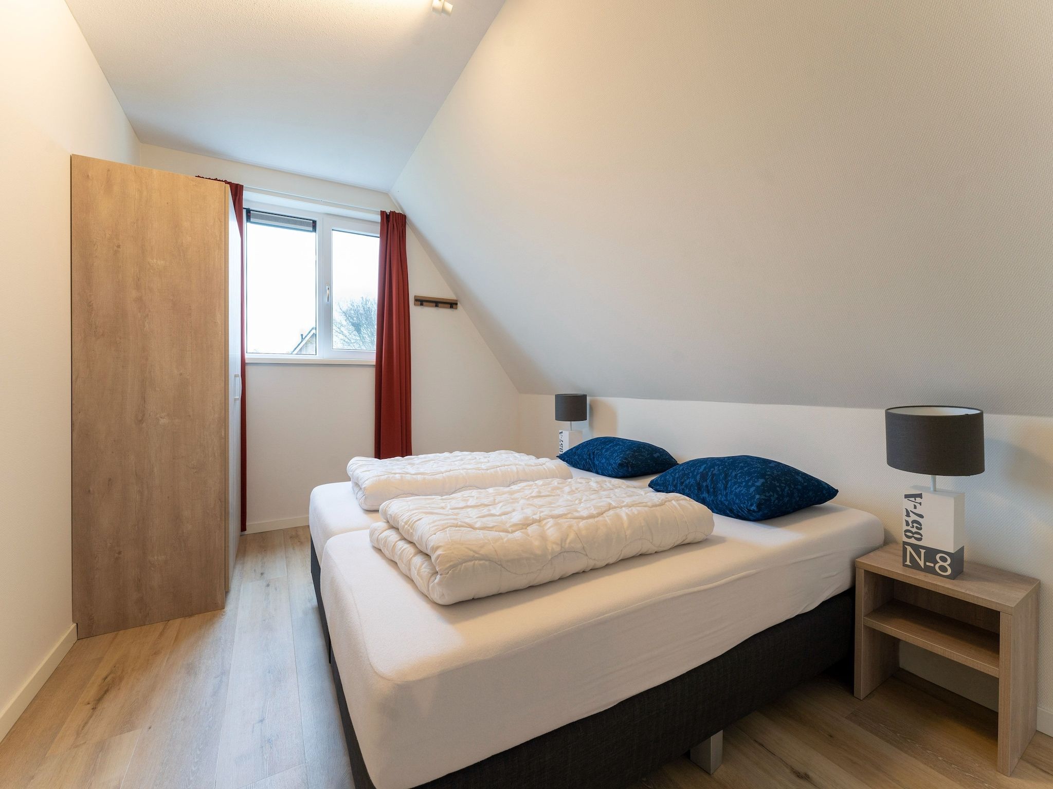 Een slaapkamer van So What 21 in De Koog Texel