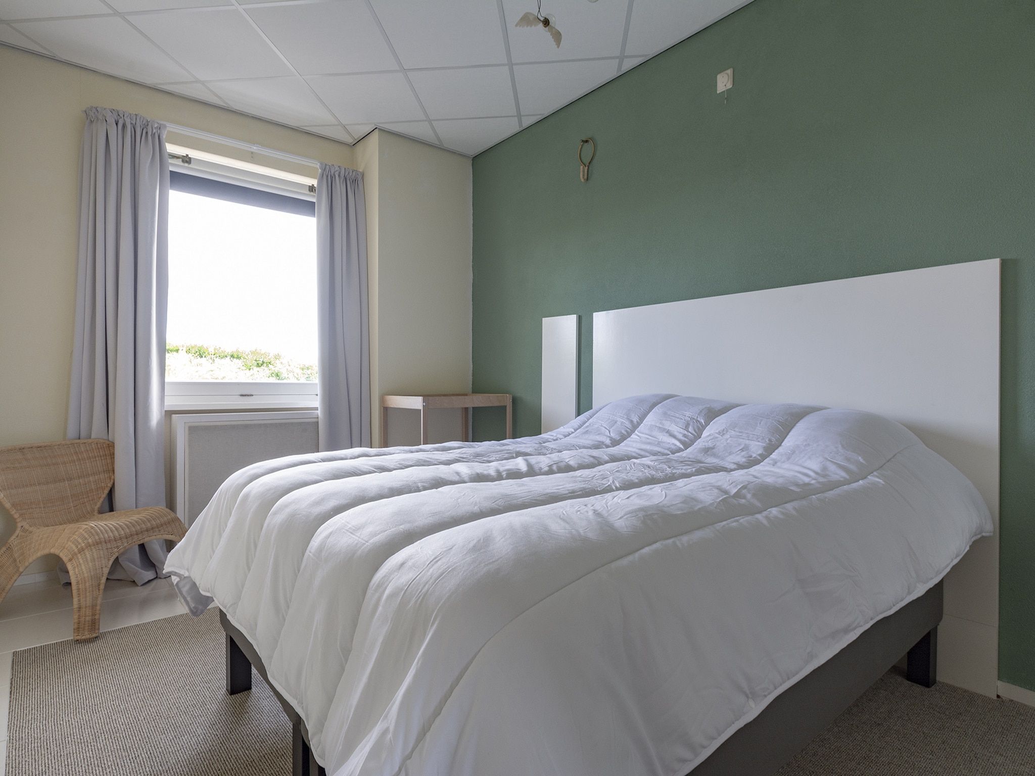Een slaapkamer van Strandslag 115 in Julianadorp aan Zee
