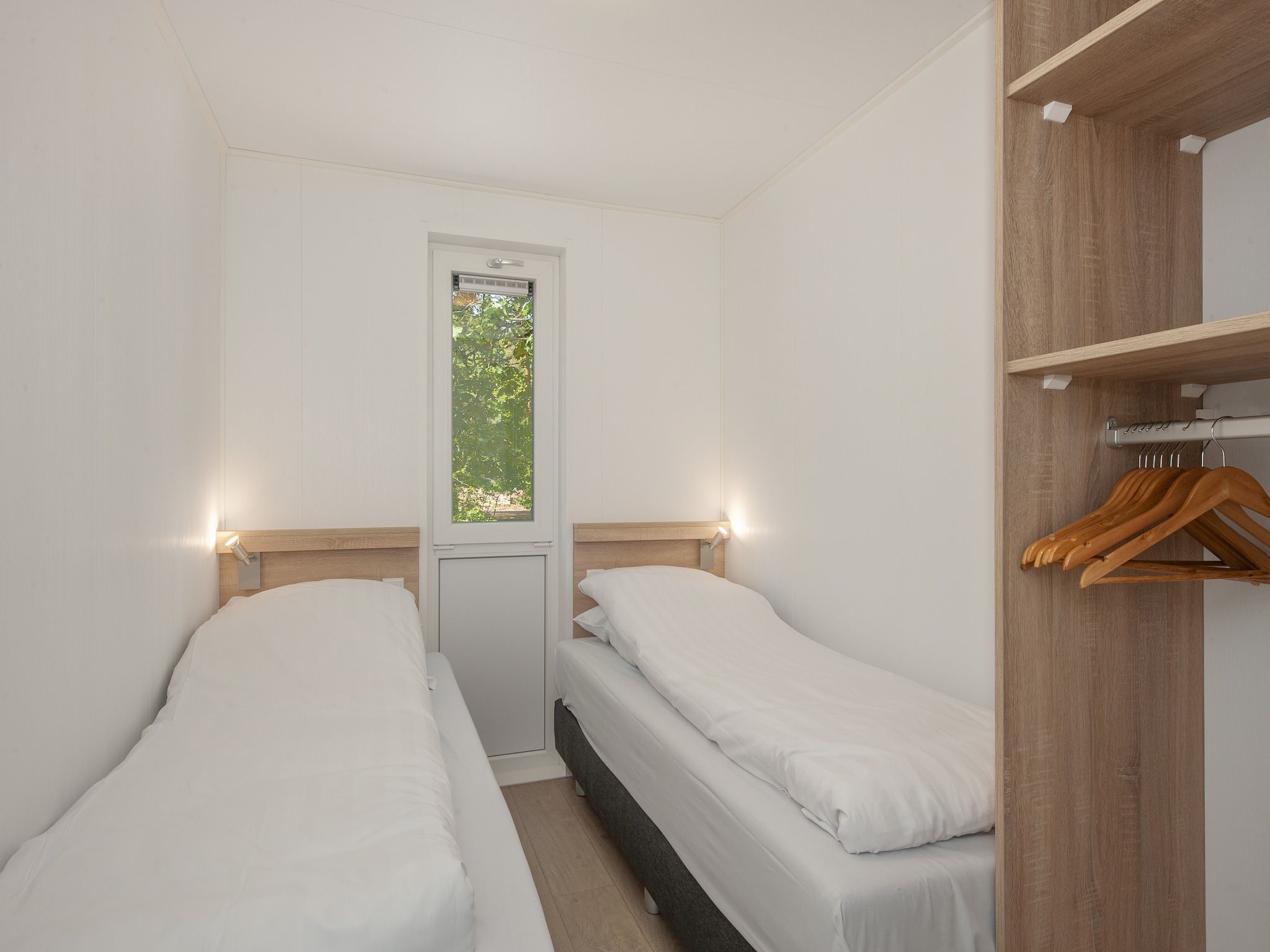Een slaapkamer van Bospark 't Wolfsven 9 in Mierlo