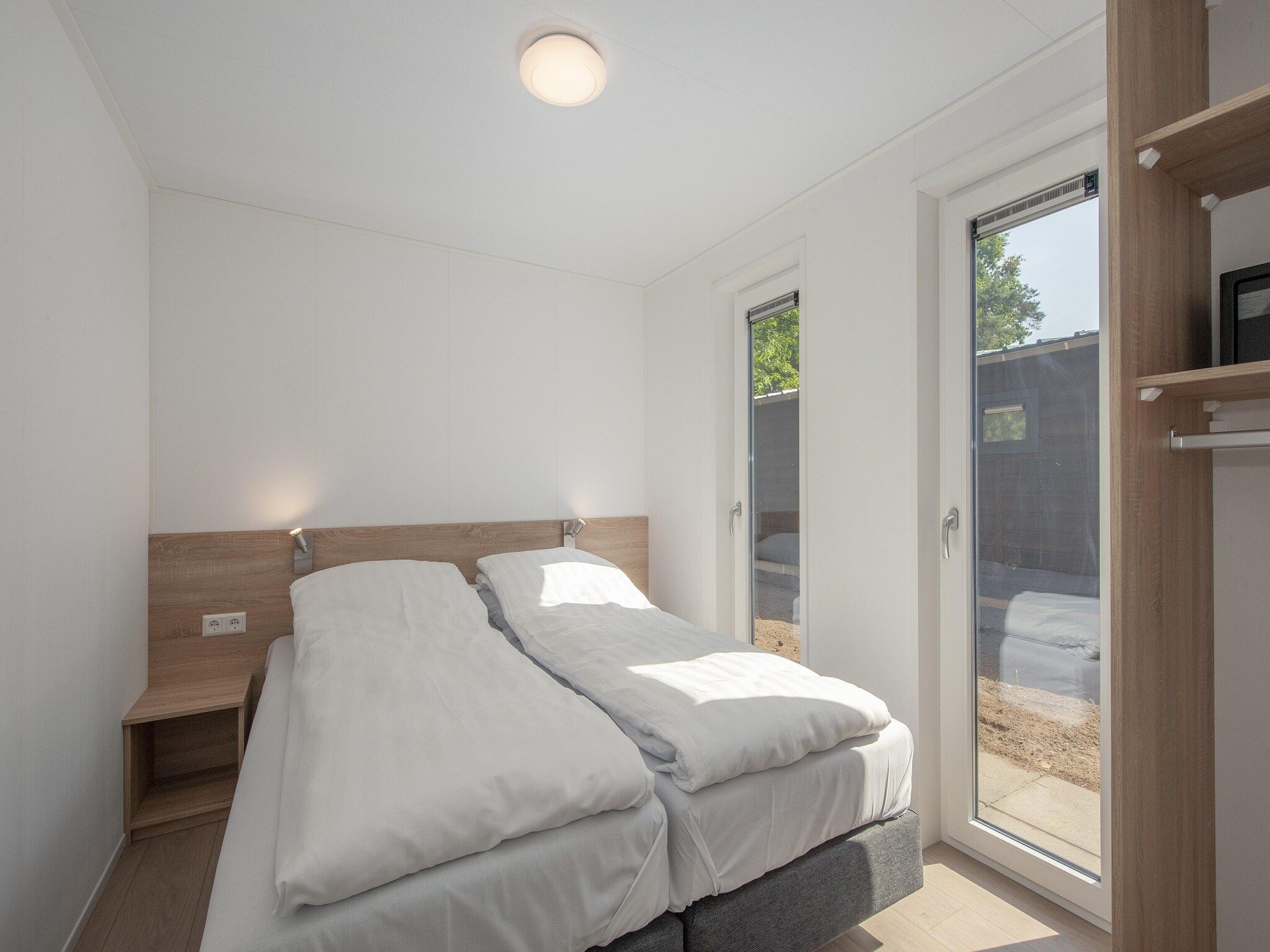 Een slaapkamer van Bospark 't Wolfsven 11 in Mierlo