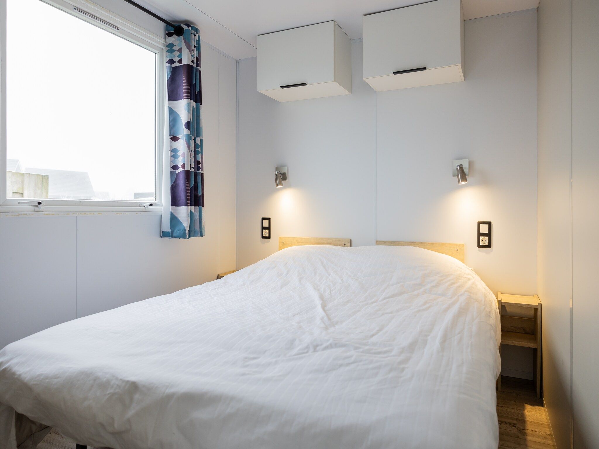Een slaapkamer van Chalet Grytsje in De Veenhoop