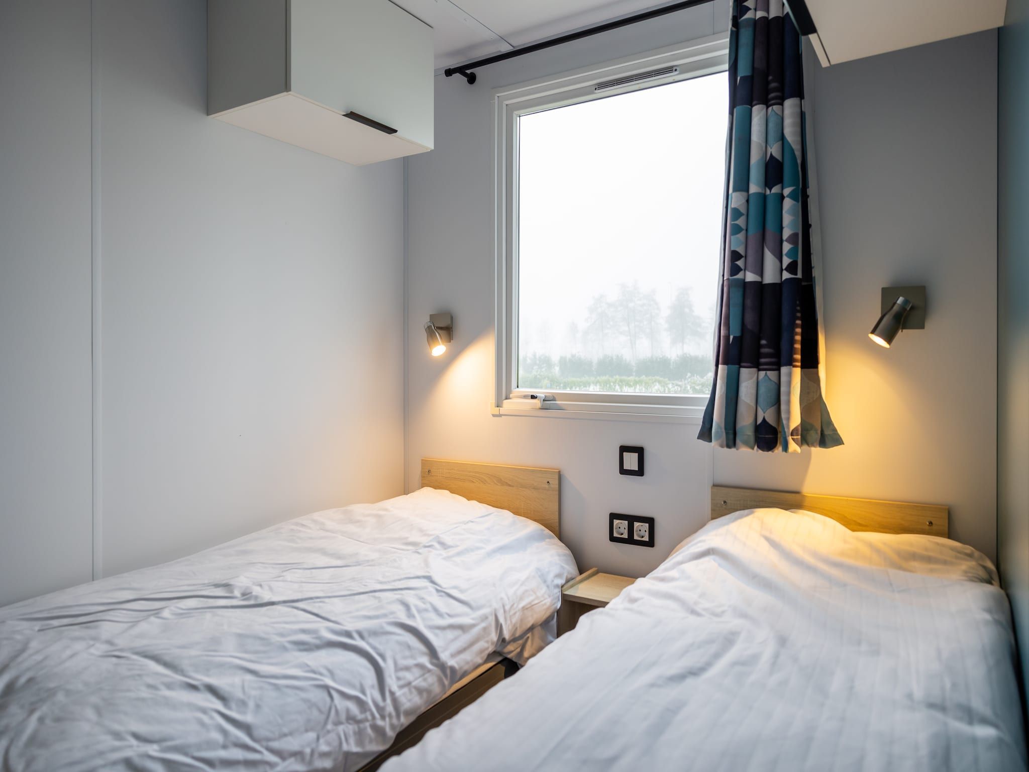 Een slaapkamer van Chalet Grytsje in De Veenhoop
