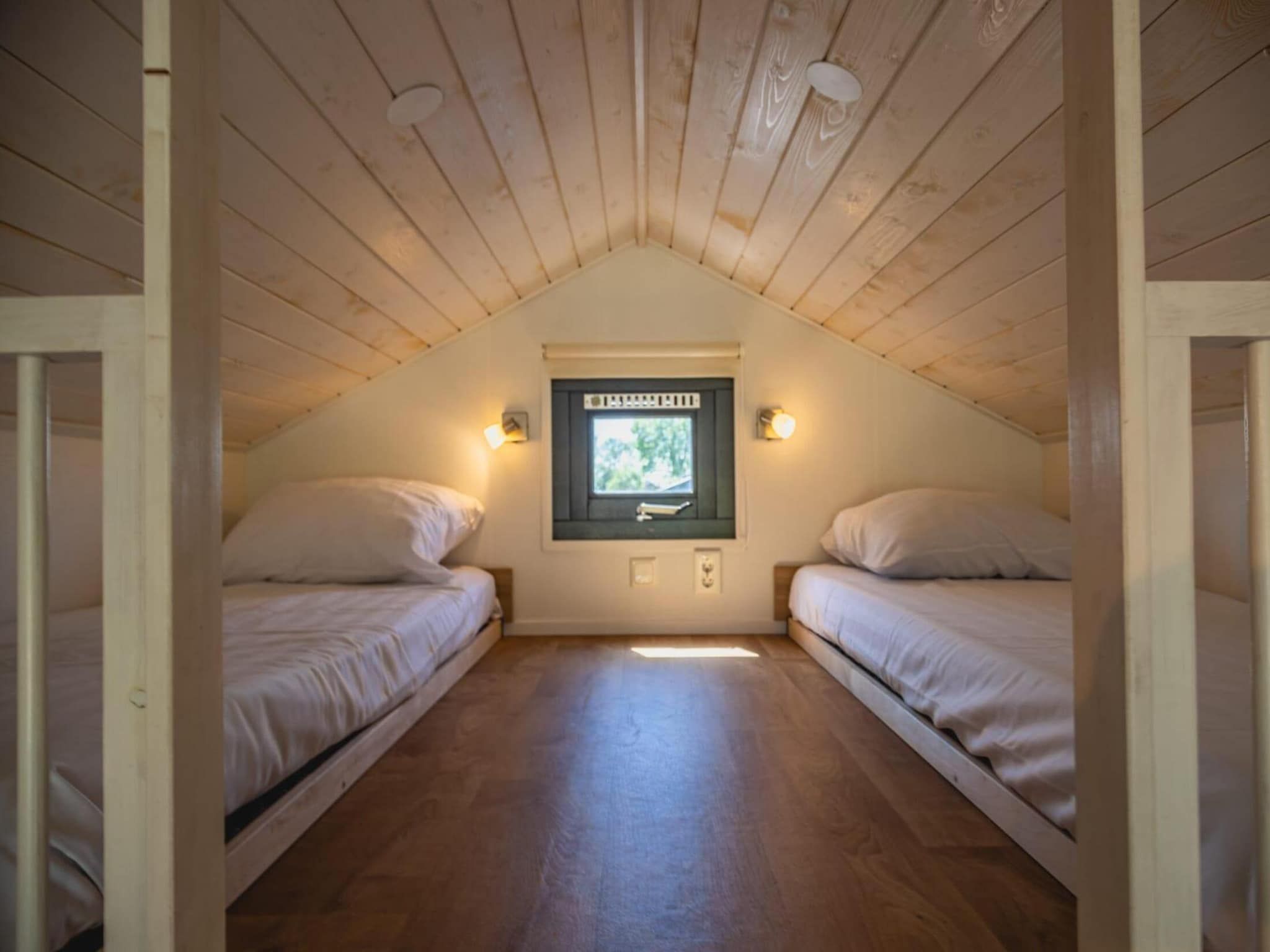 Een slaapkamer van Tiny Lodge  4 personen in West-Graftdijk