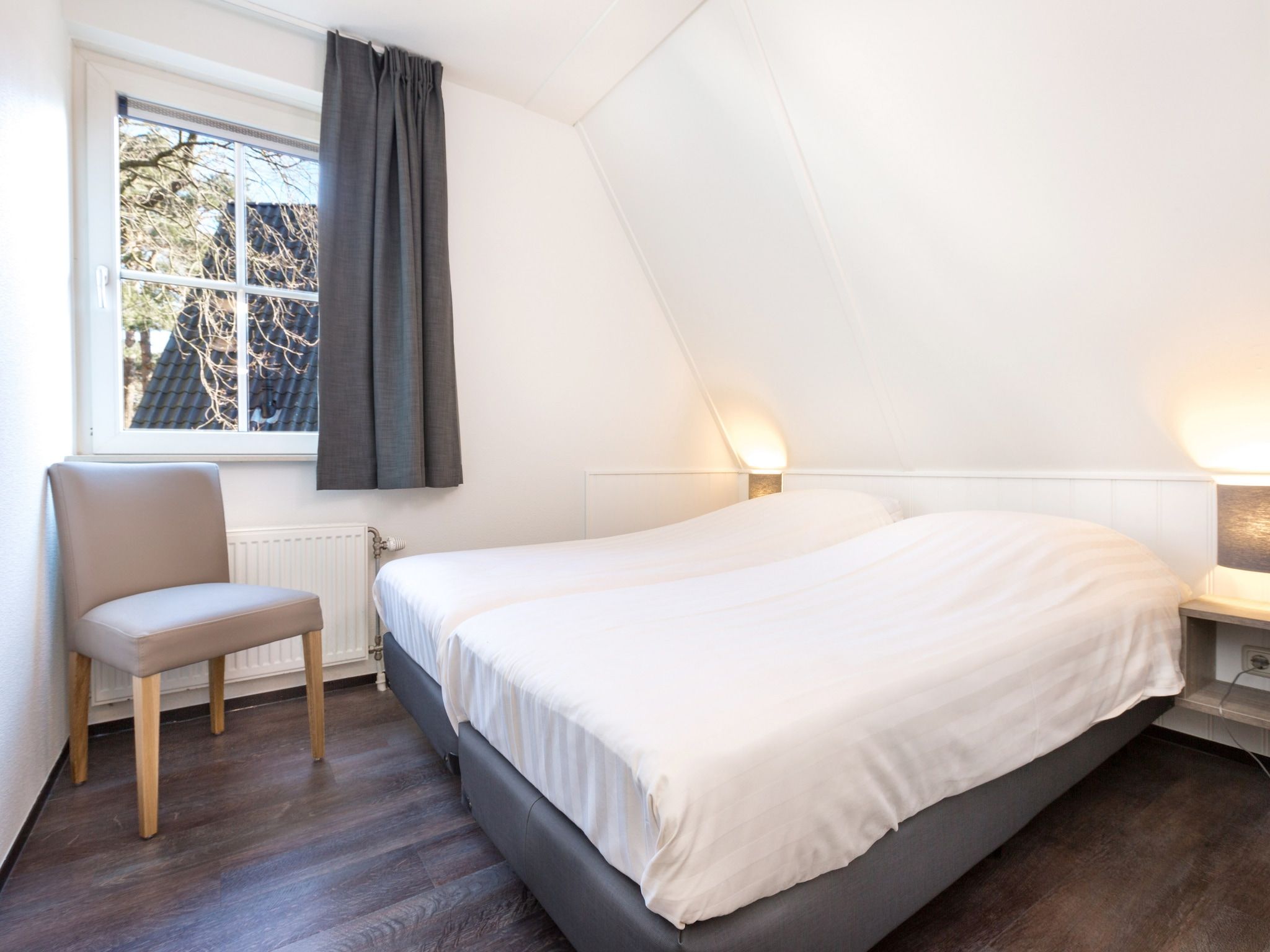 Een slaapkamer van Vakantiepark de Katjeskelder 14 in Oosterhout