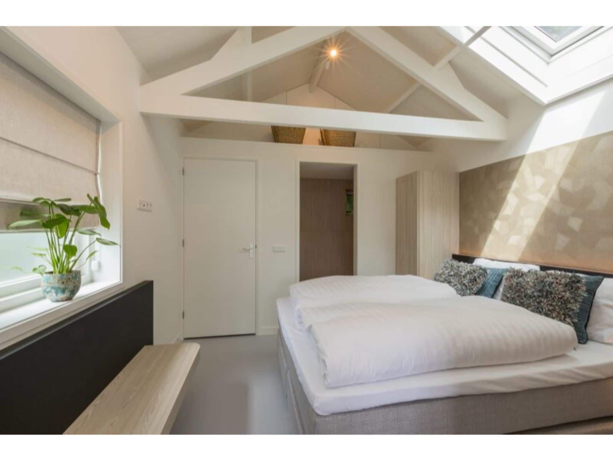 Een slaapkamer van Duinenburg 23 in Domburg