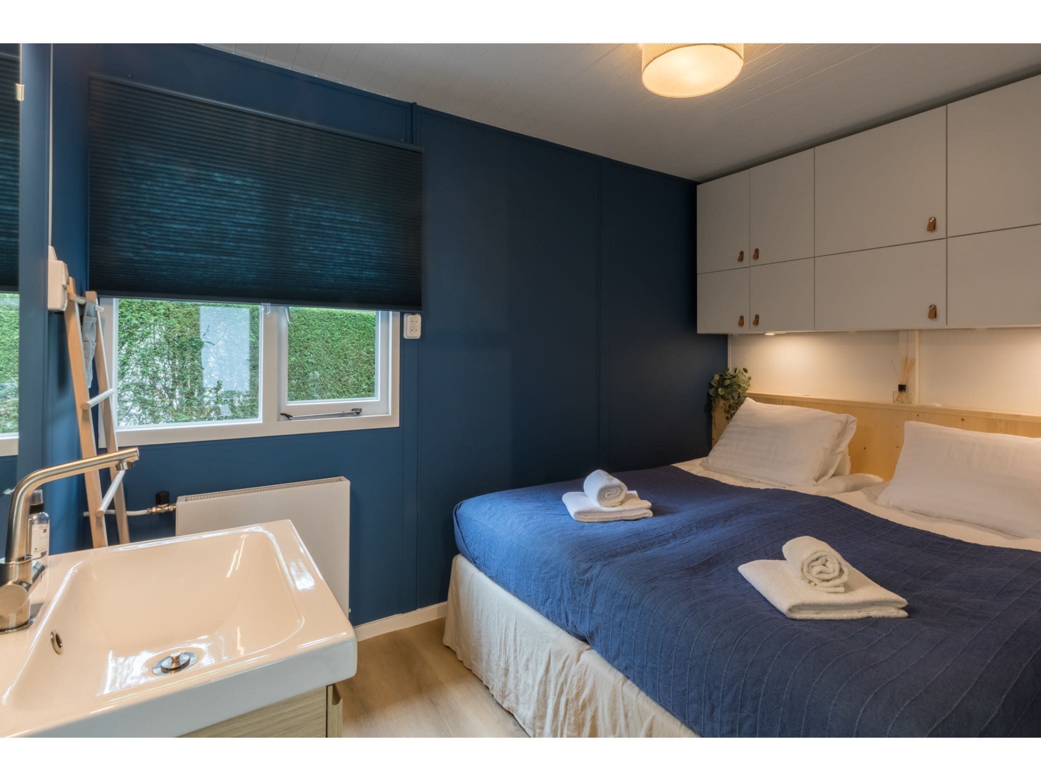 Een slaapkamer van Vakantiehuis Noordendolfer 2 huisje 49 in Zoutelande