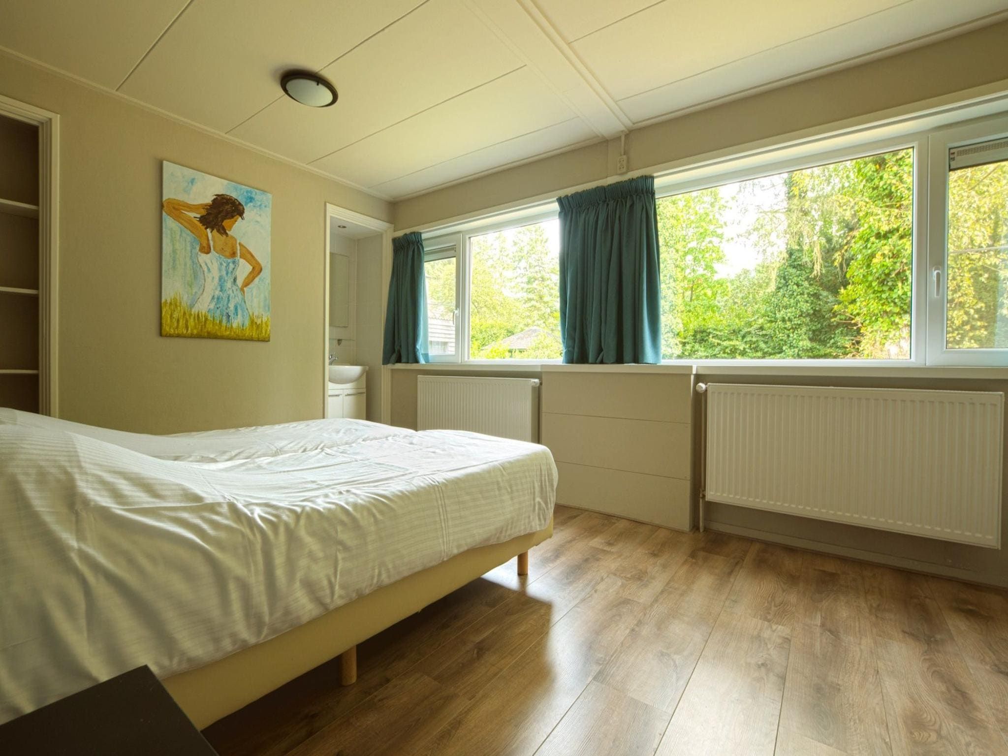 Een slaapkamer van Familiehuis Ruighenrode in Lochem