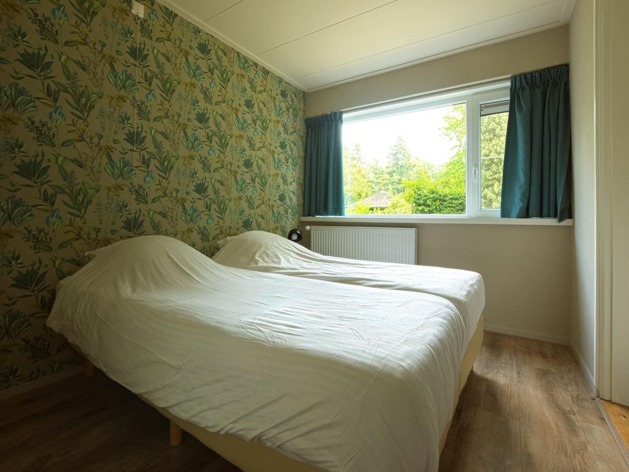 Een slaapkamer van Familiehuis Ruighenrode in Lochem
