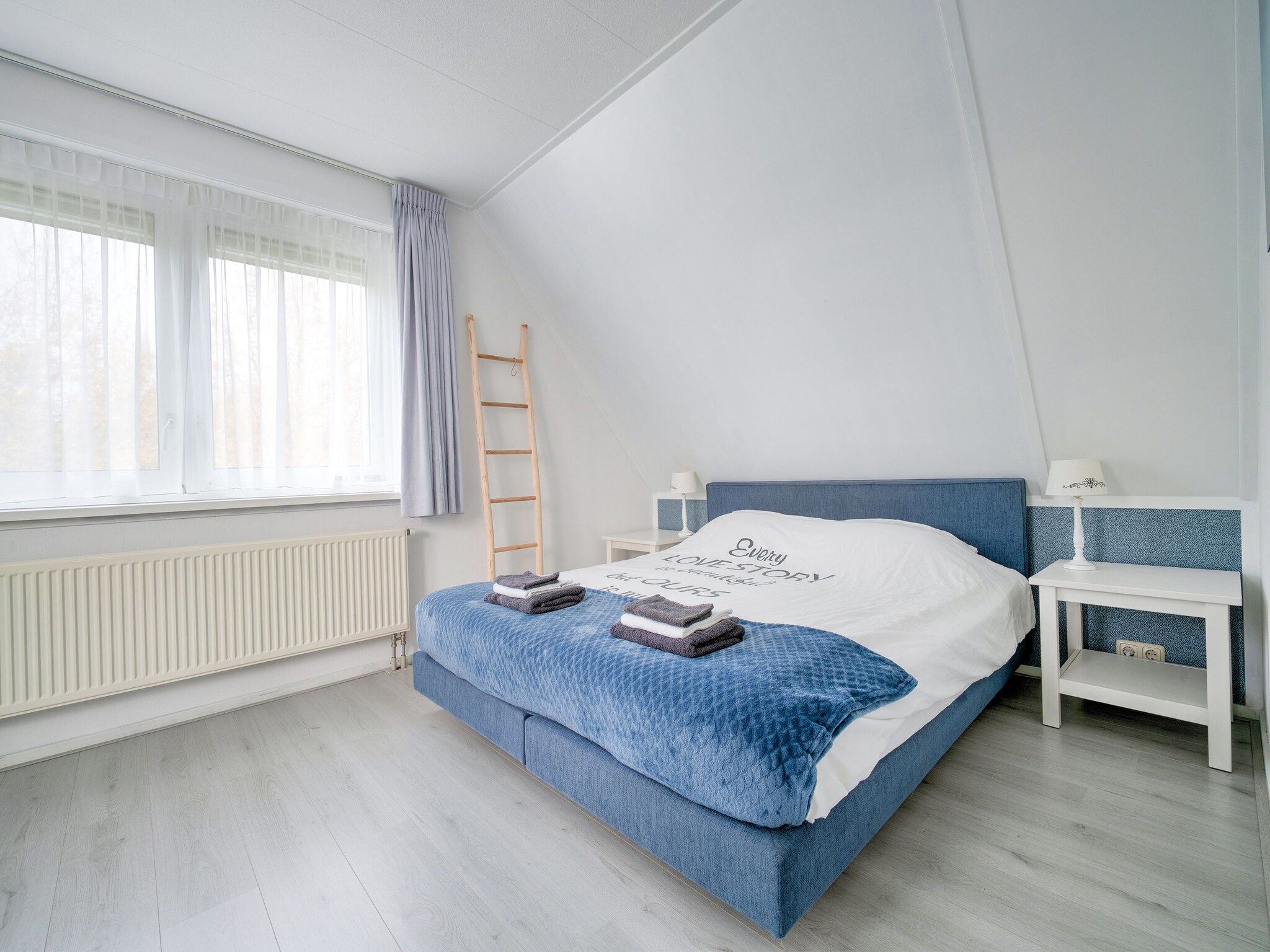 Een slaapkamer van Zonnig Hosterwold in Zeewolde