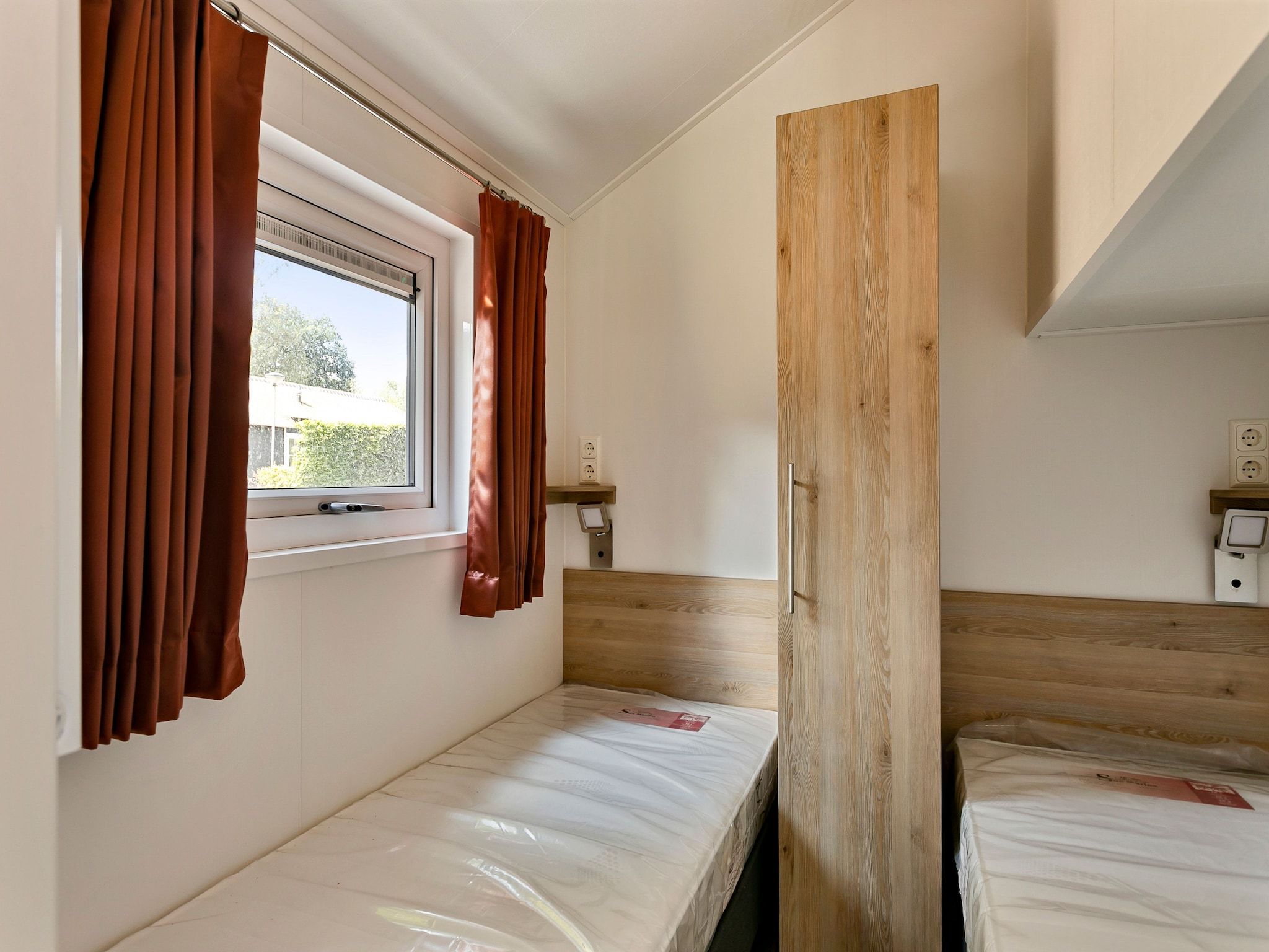 Een slaapkamer van Recreatiepark Tolplas 16 in Hoge Hexel