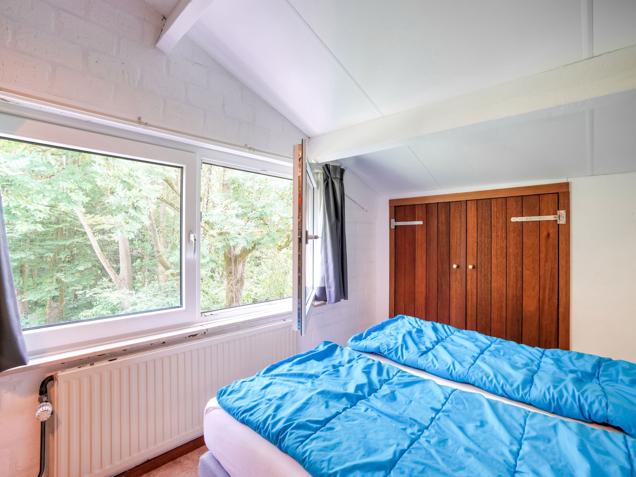 Een slaapkamer van Waterval 8P in Ulestraten