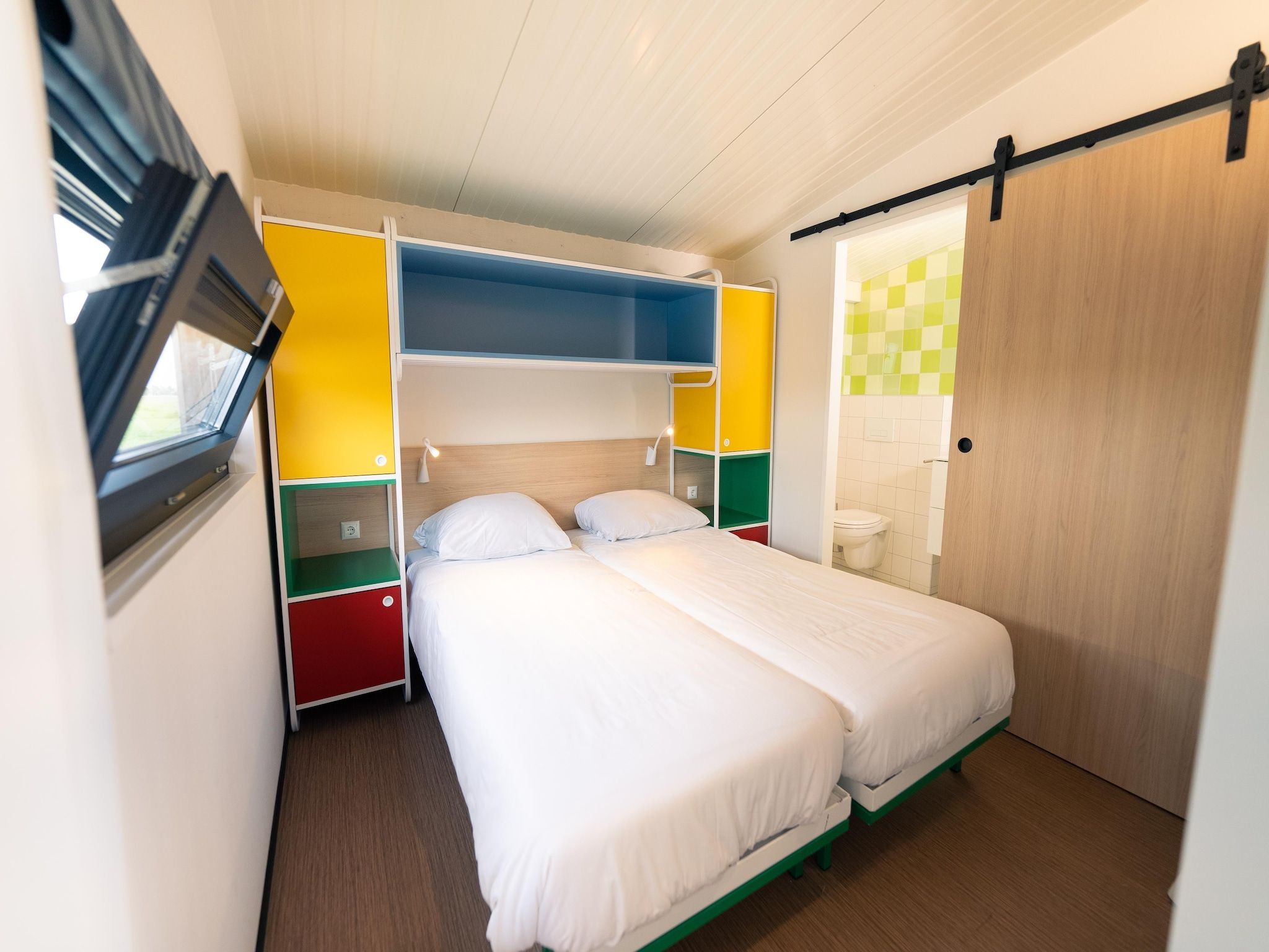 Een slaapkamer van Resort Callantsoog 3 in Callantsoog