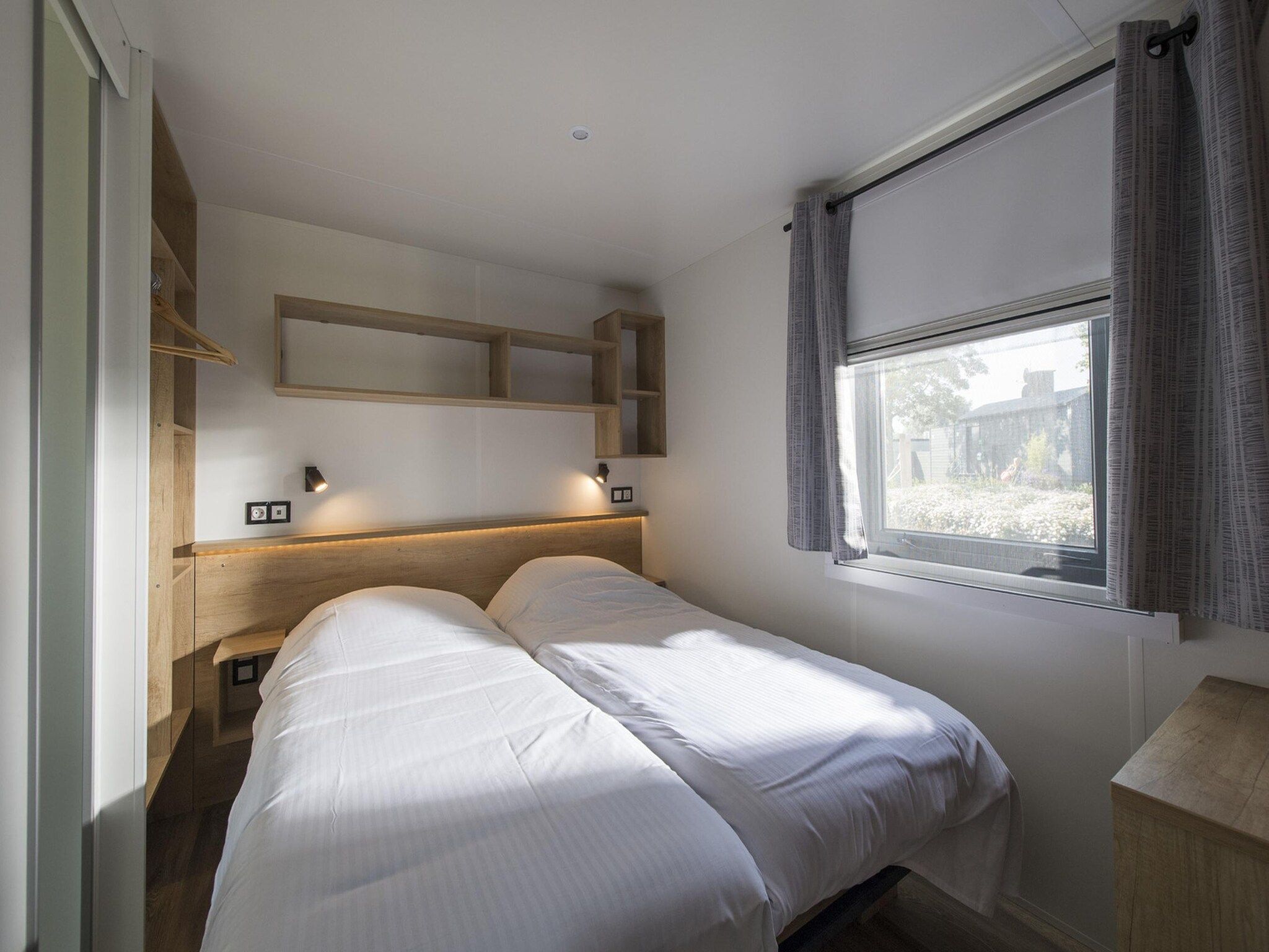 Een slaapkamer van Vakantiepark Eiland van Maurik 8 in Maurik