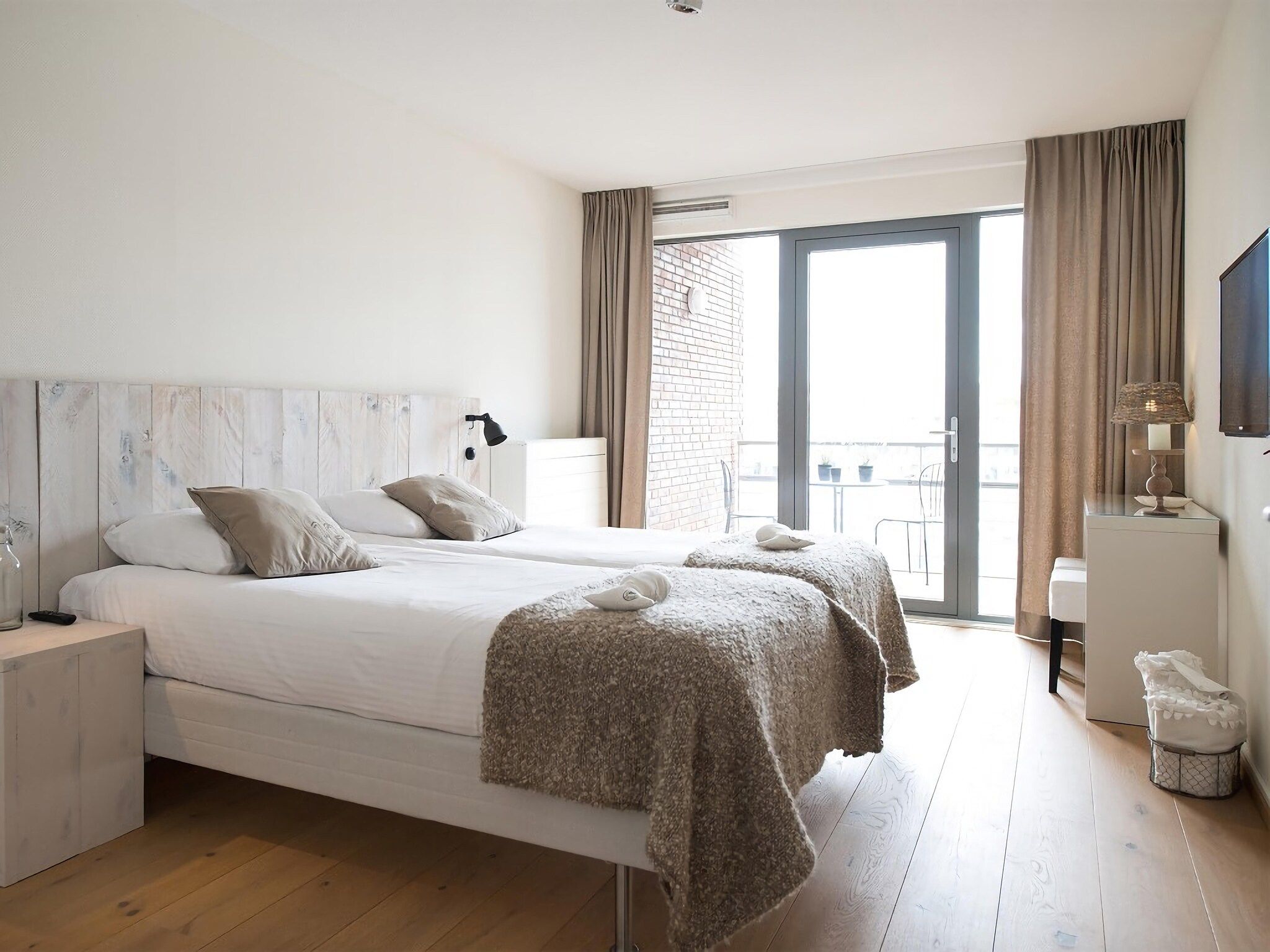 Een slaapkamer van Scheveningen Harbour 22B in Den Haag