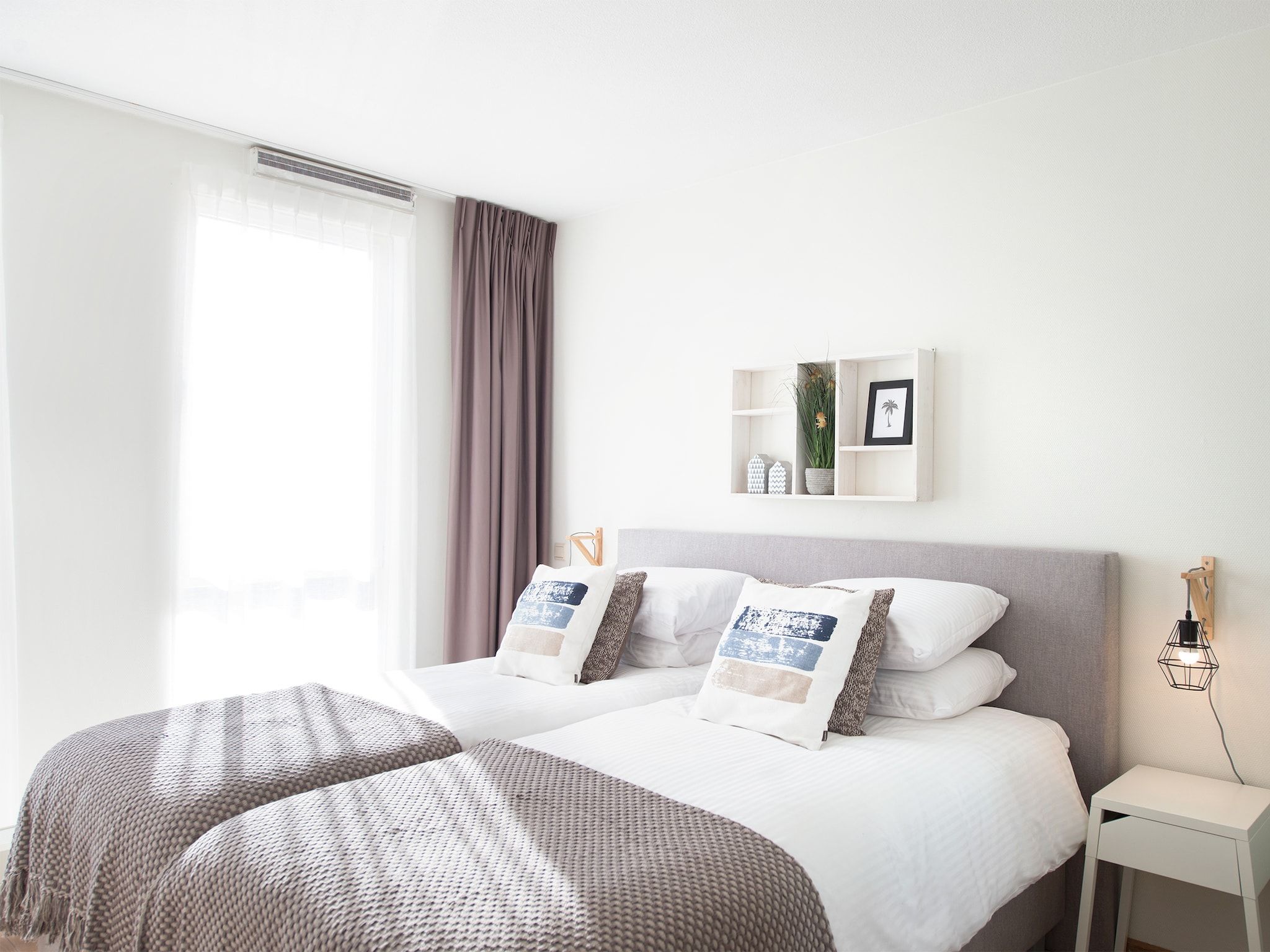 Een slaapkamer van Scheveningen Harbour 28B in Den Haag