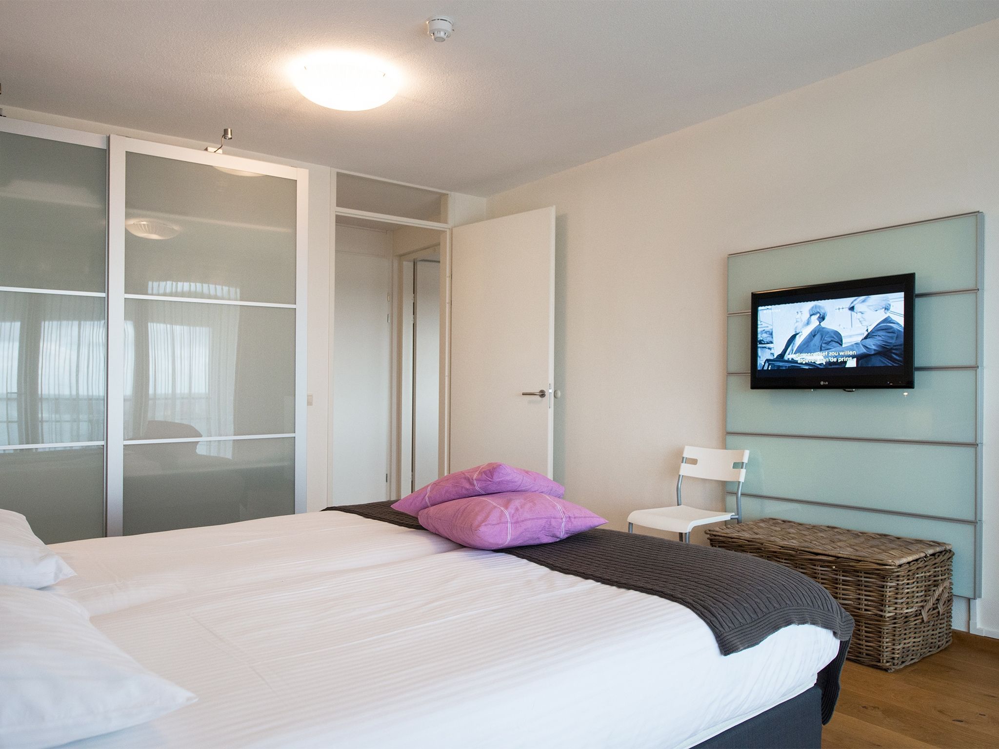 Een slaapkamer van Scheveningen Harbour 40 in Den Haag