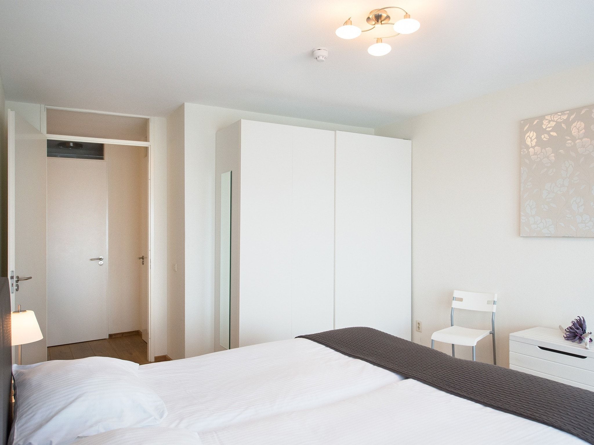 Een slaapkamer van Scheveningen Harbour 40 in Den Haag