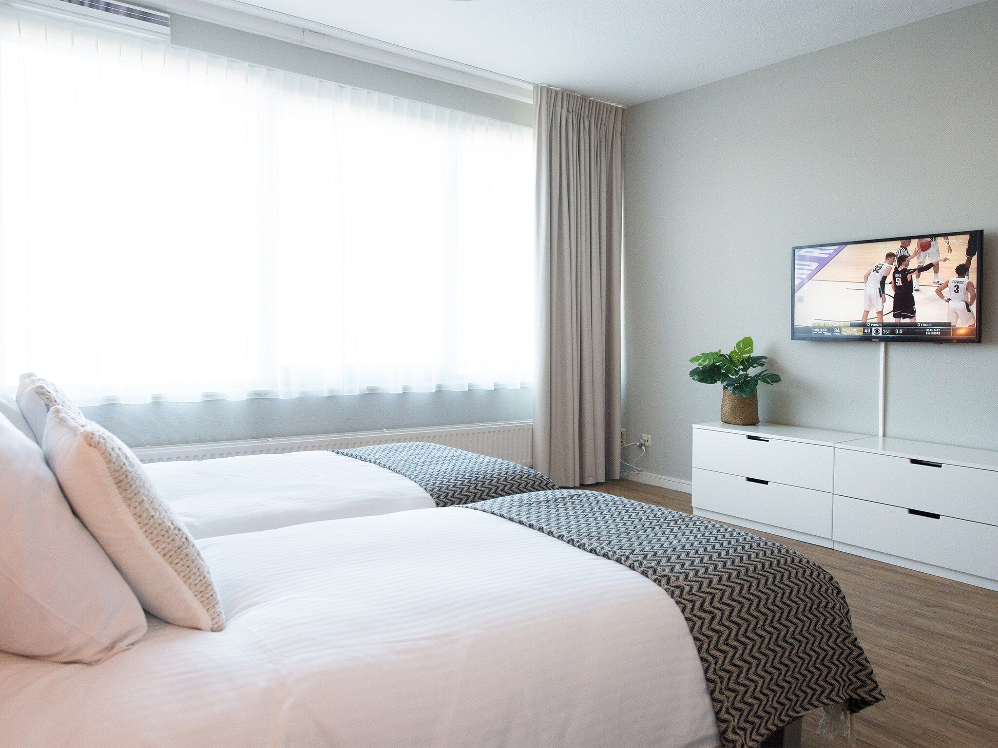Een slaapkamer van Scheveningen Harbour 58 in Den Haag