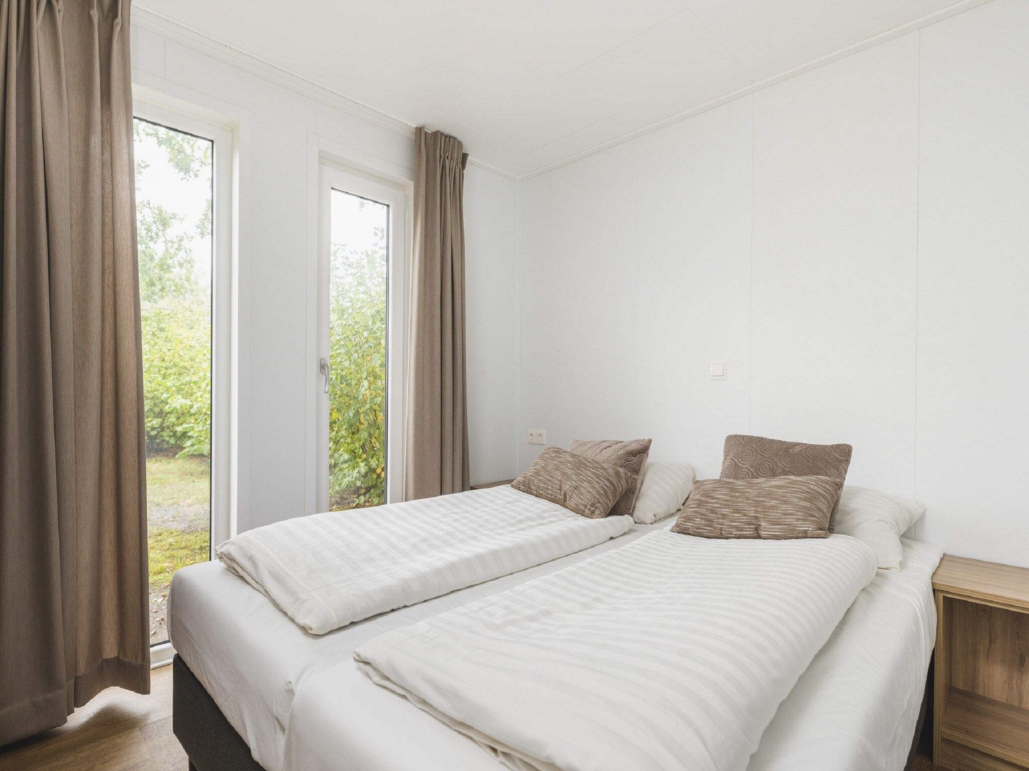 Een slaapkamer van Vakantiepark Mölke 30 in Zuna