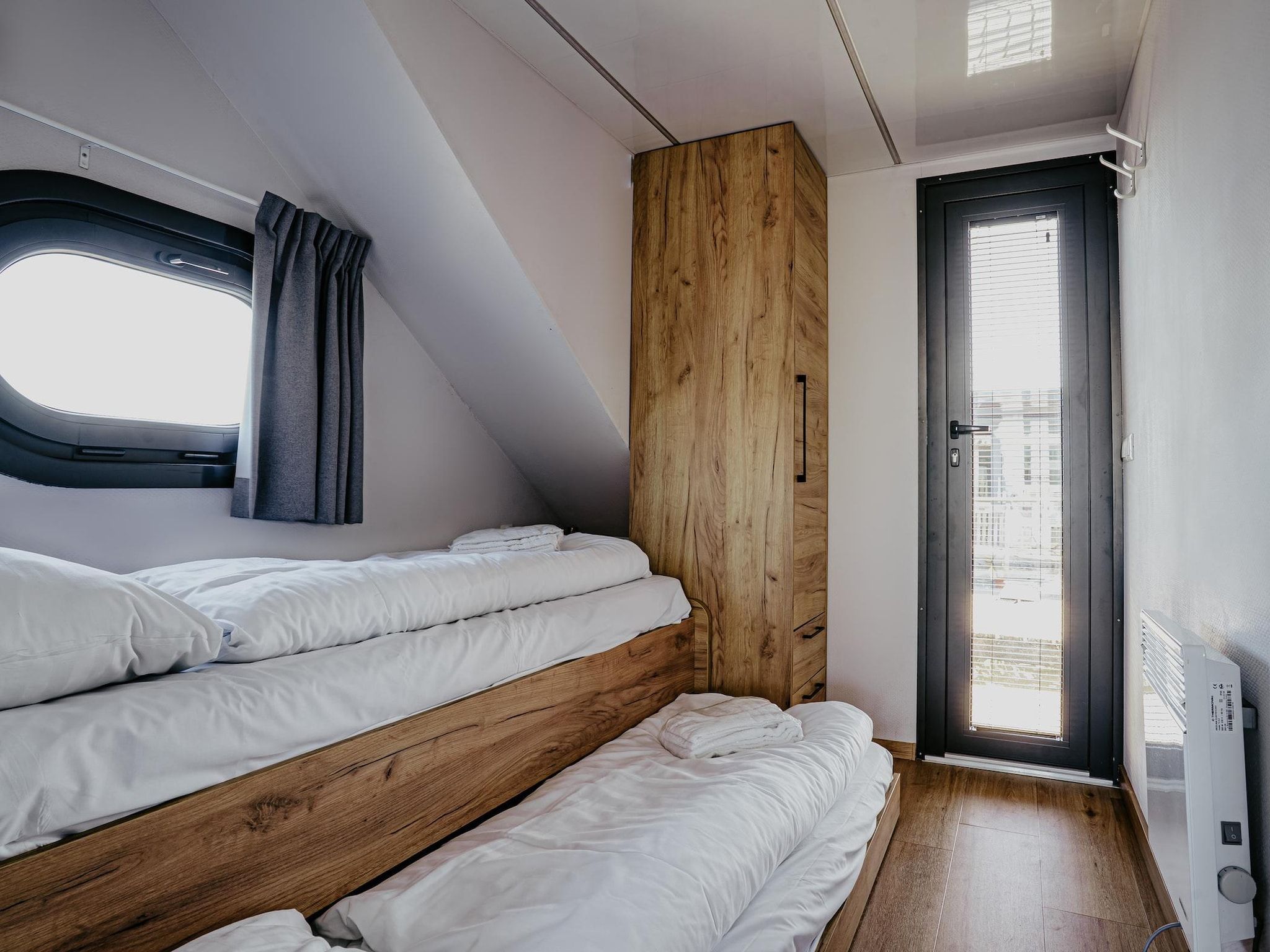 Een slaapkamer van Waterpark de Meerparel 10 in Uitgeest