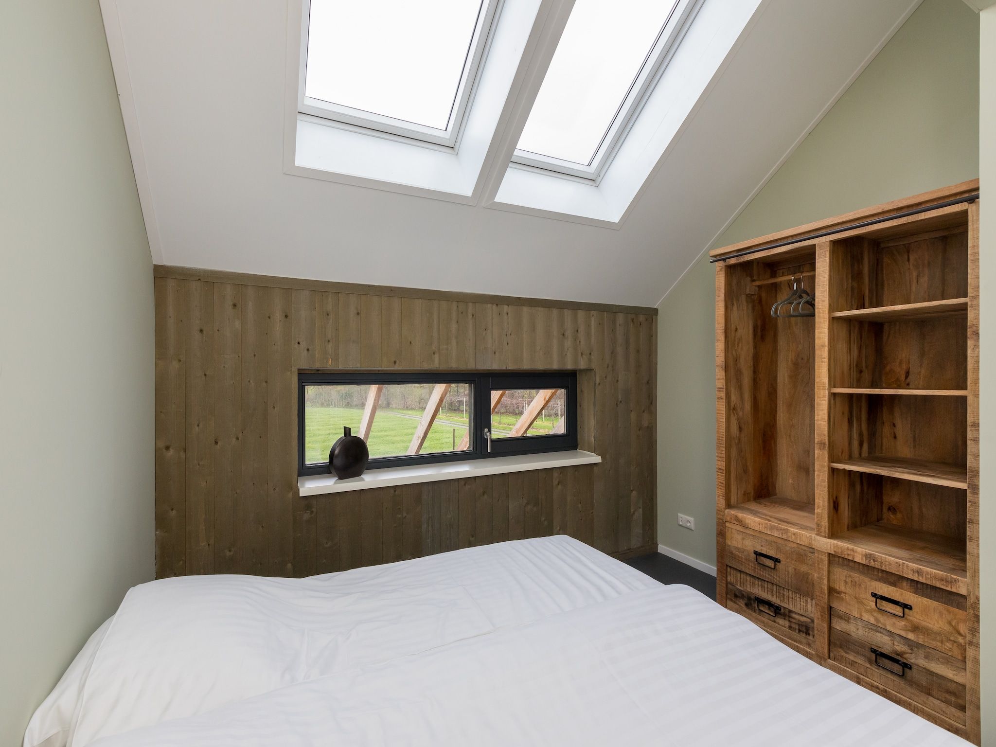 Een slaapkamer van Vroondijk 2-Zeebloesempje in Vrouwenpolder