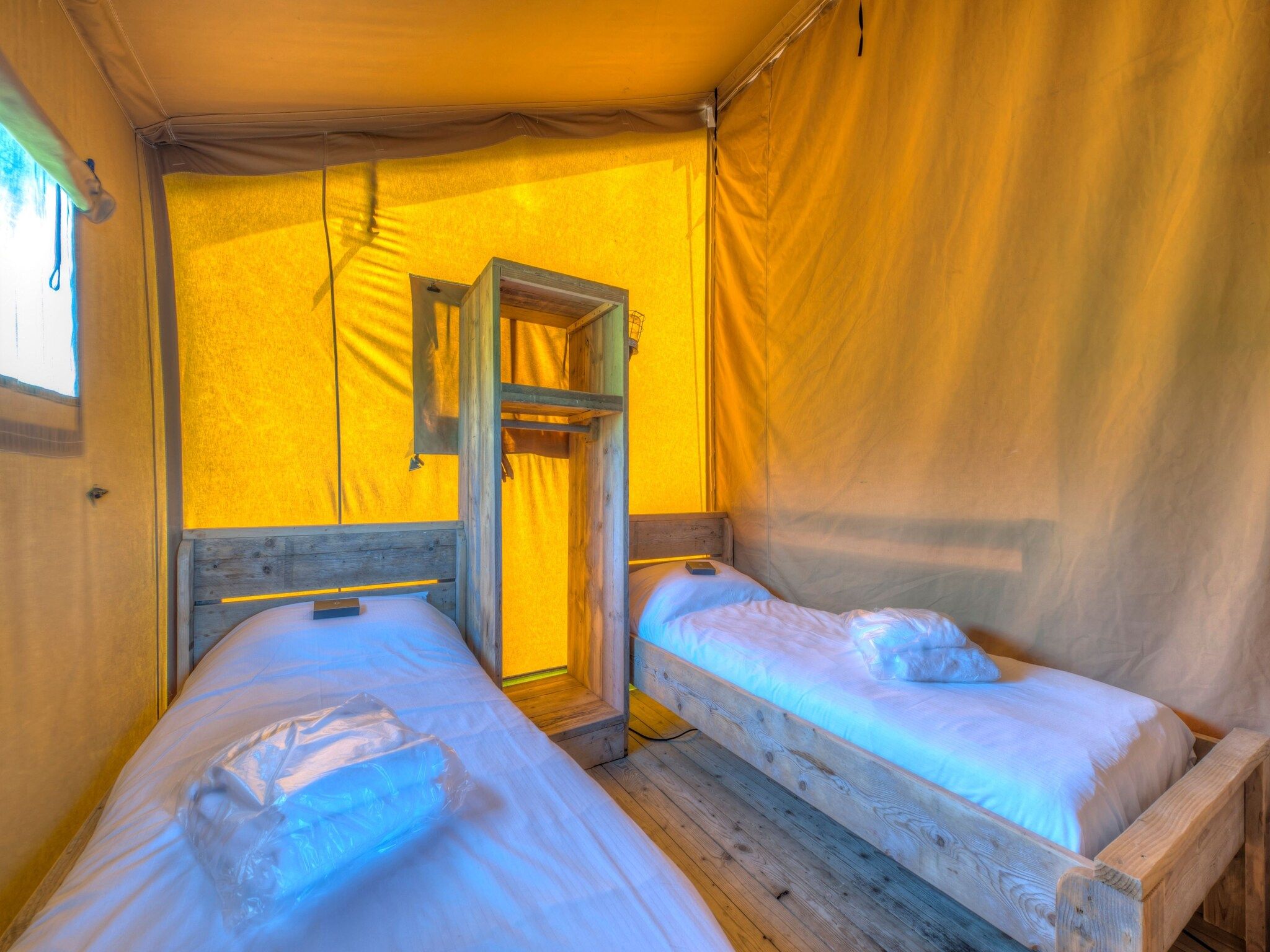 Een slaapkamer van Vakantiepark de Katjeskelder 19 in Oosterhout