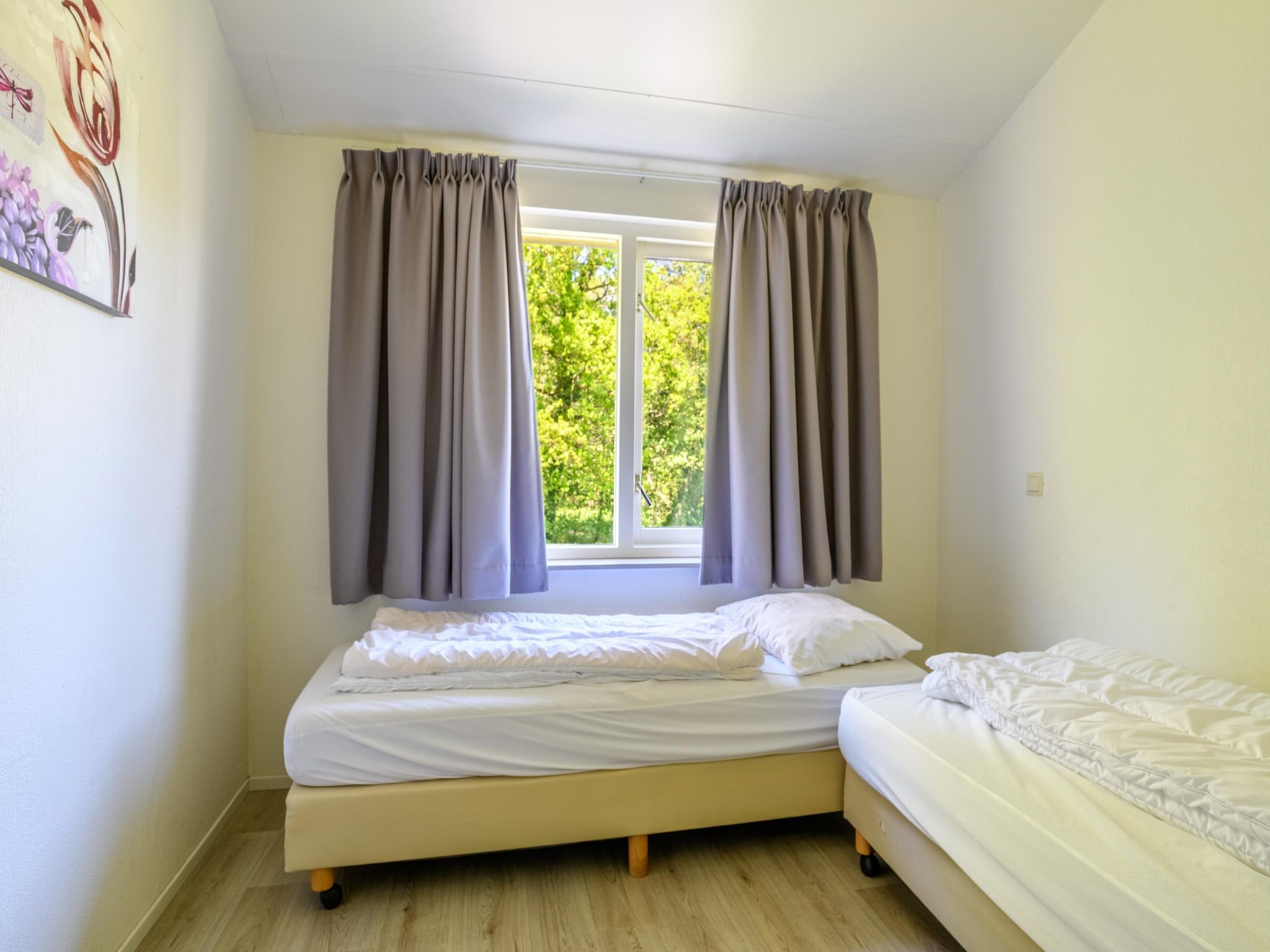 Een slaapkamer van Vakantiepark Emslandermeer 13 in Vlagtwedde