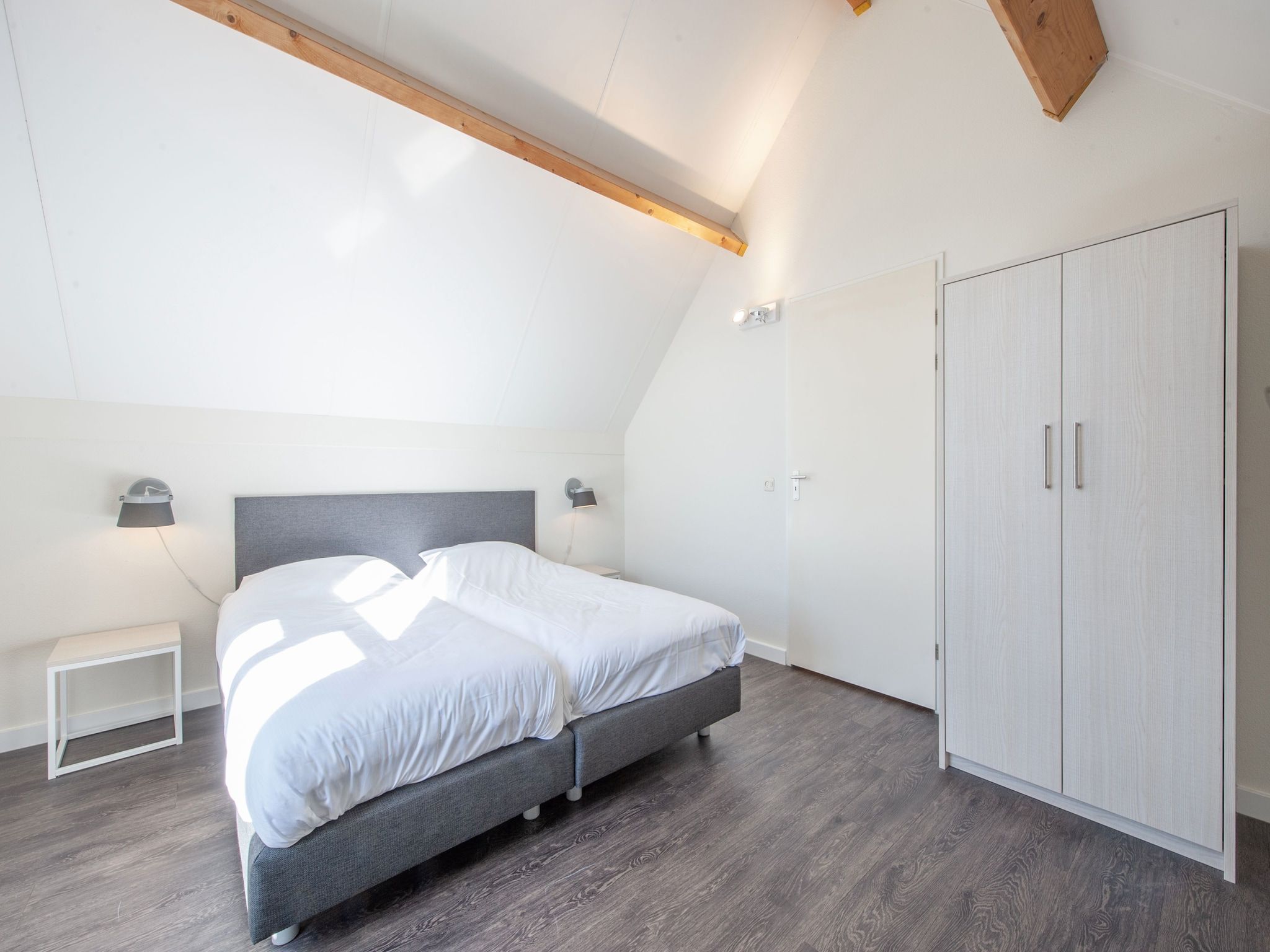 Een slaapkamer van Noordzee Résidence De Banjaard 18 in Kamperland