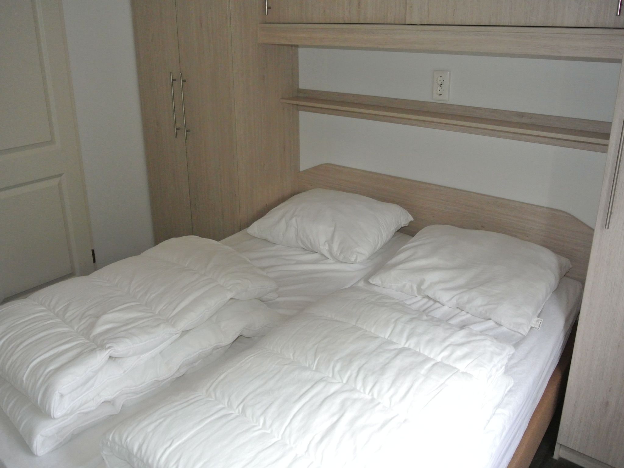 Een slaapkamer van Vakantiepark Giethoorn 7 in Giethoorn