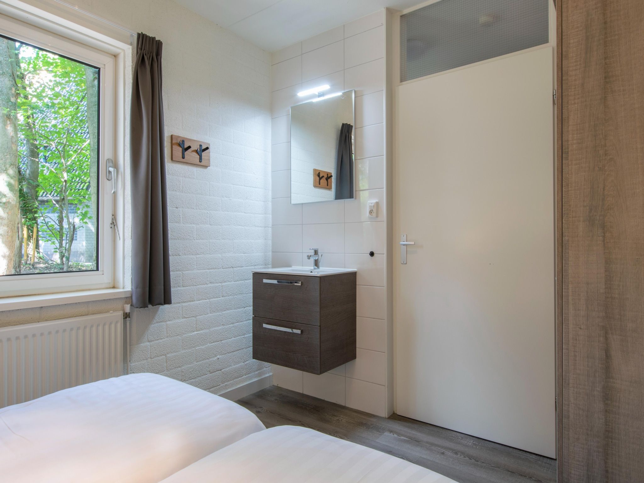 Een slaapkamer van Vakantiepark de Katjeskelder 15 in Oosterhout