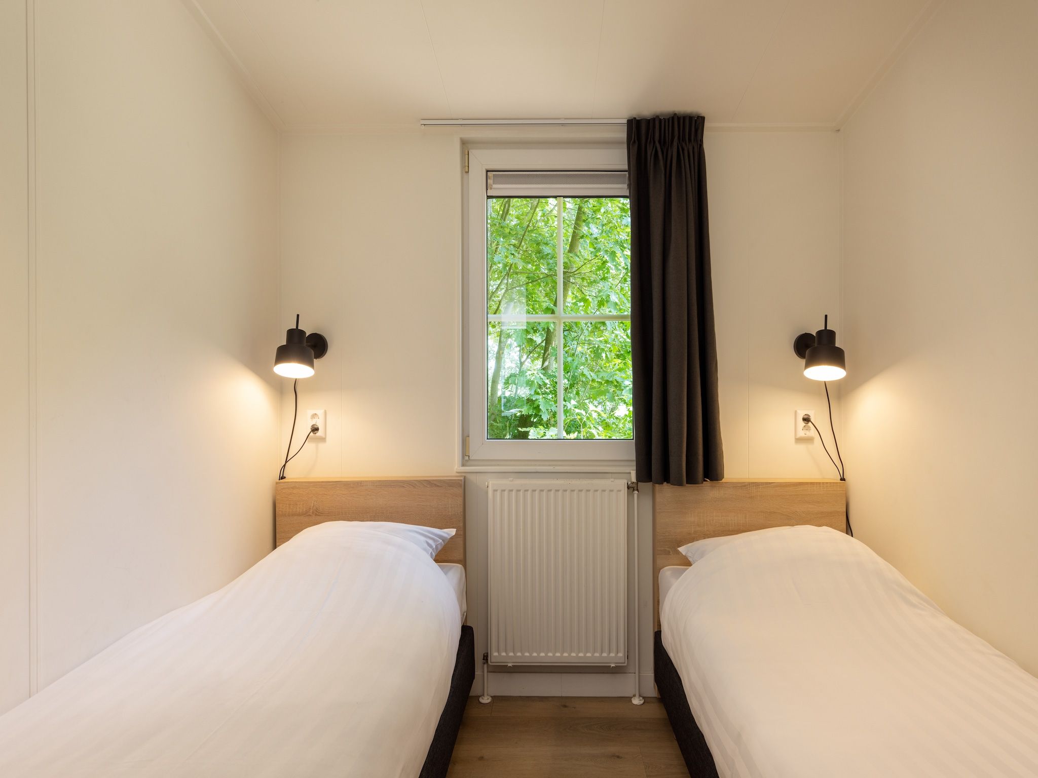 Een slaapkamer van Park De Peel 2 in Vlierden