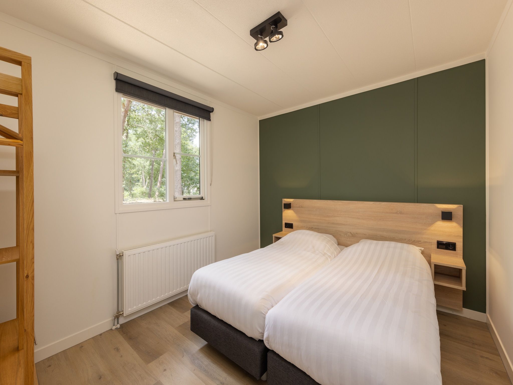 Een slaapkamer van Park De Peel 4 in Vlierden