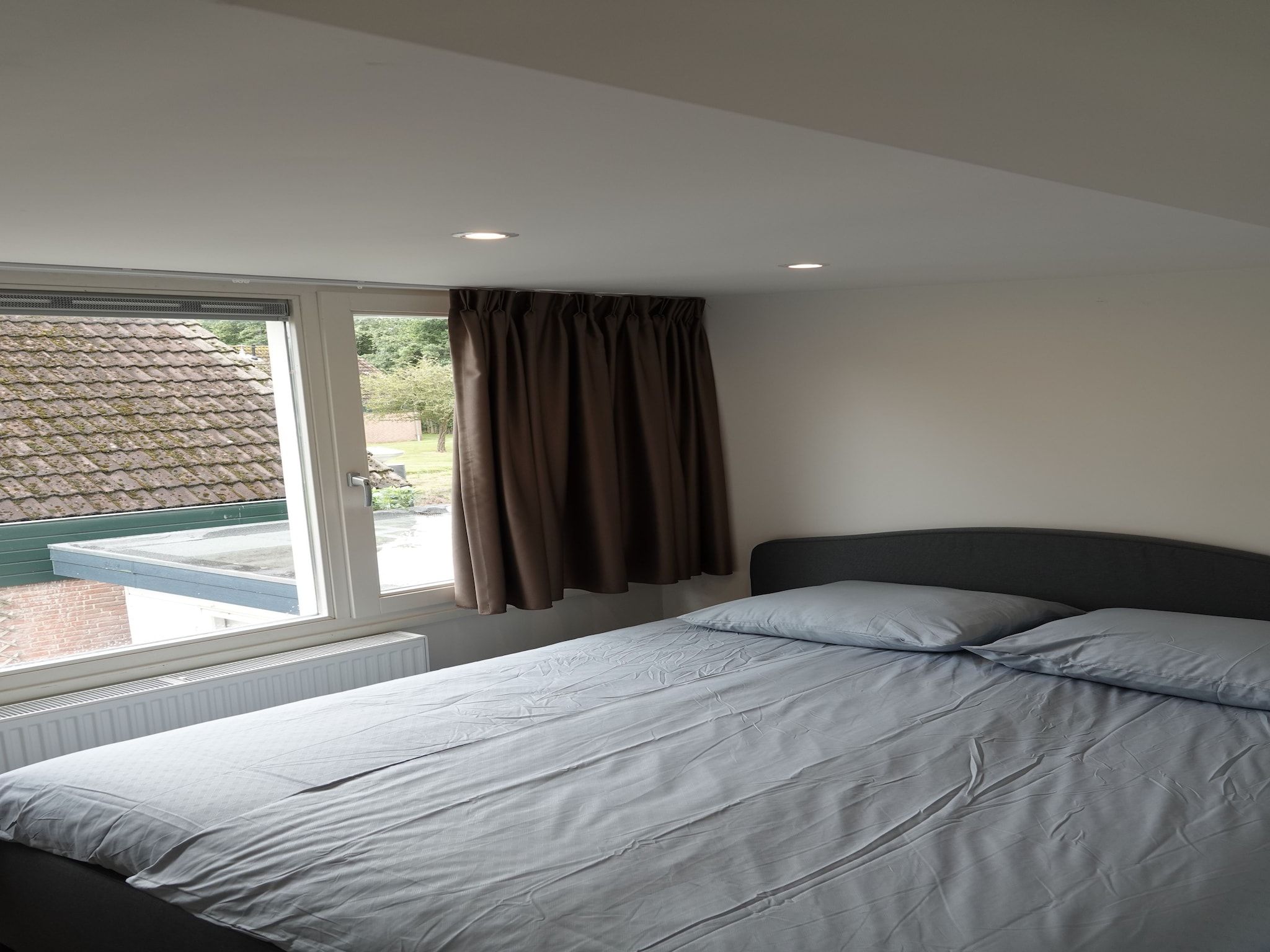 Een slaapkamer van Relaxing Summer in Noordwijkerhout