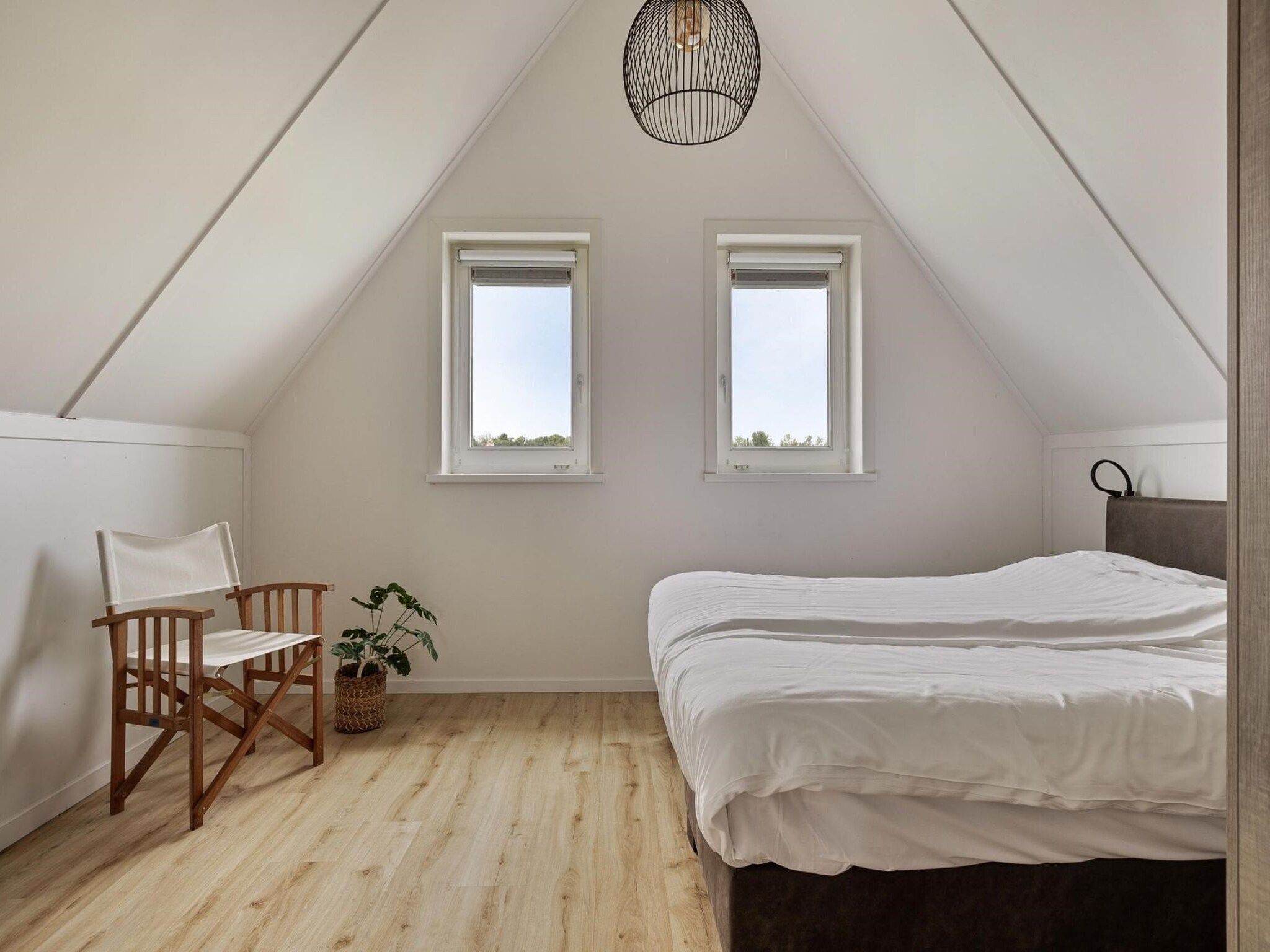 Een slaapkamer van De Ooievaar Huis Nr 47 in Scherpenisse